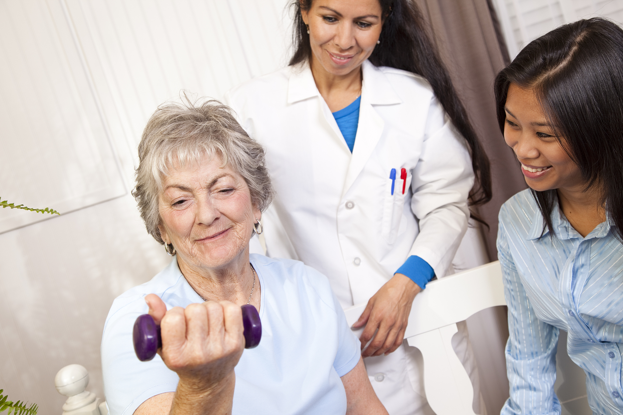 senior woman. physical therapy with doctor, family member. lifti