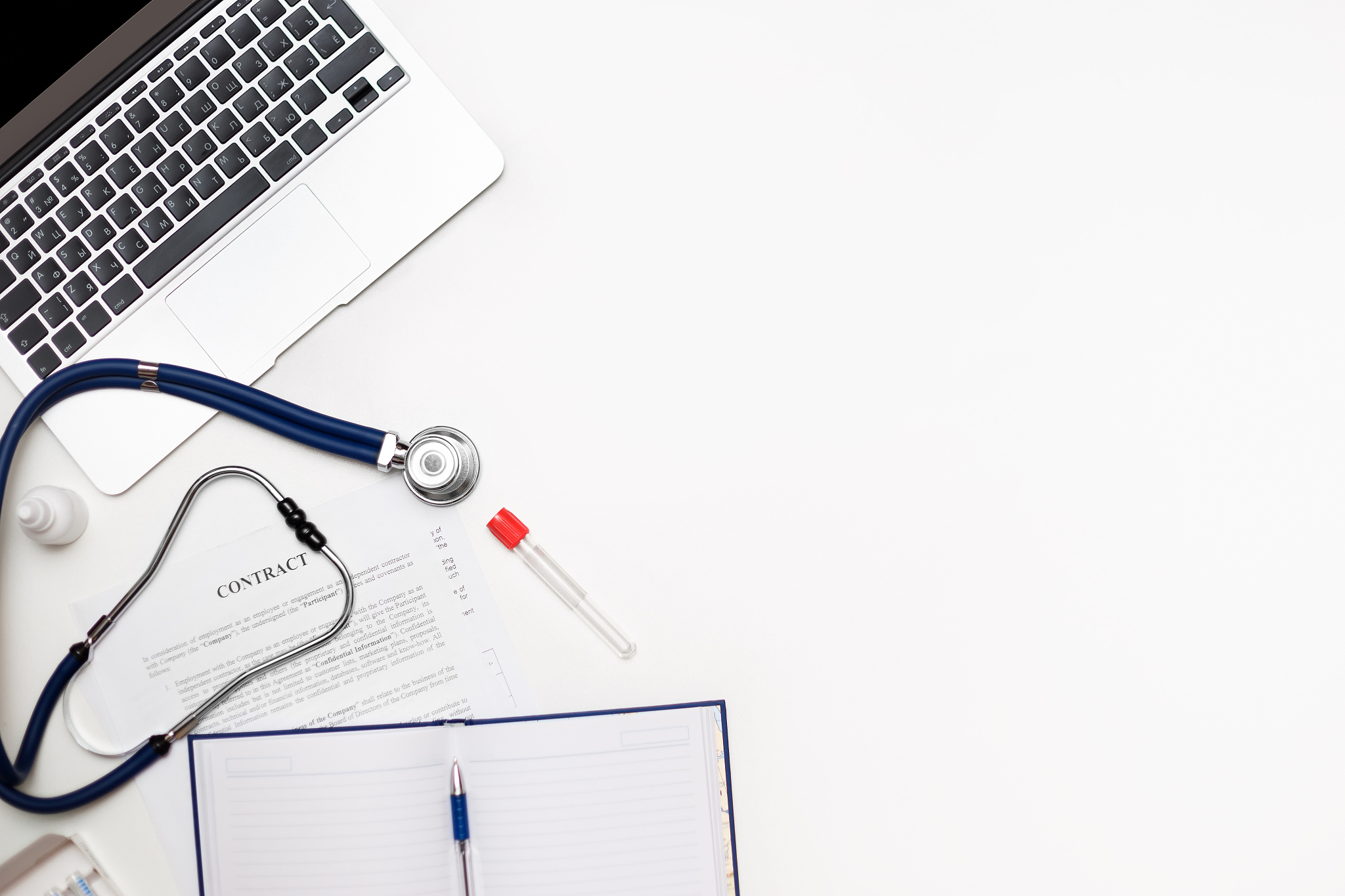 conceptual doctor workplace and a new contract. top view on whit