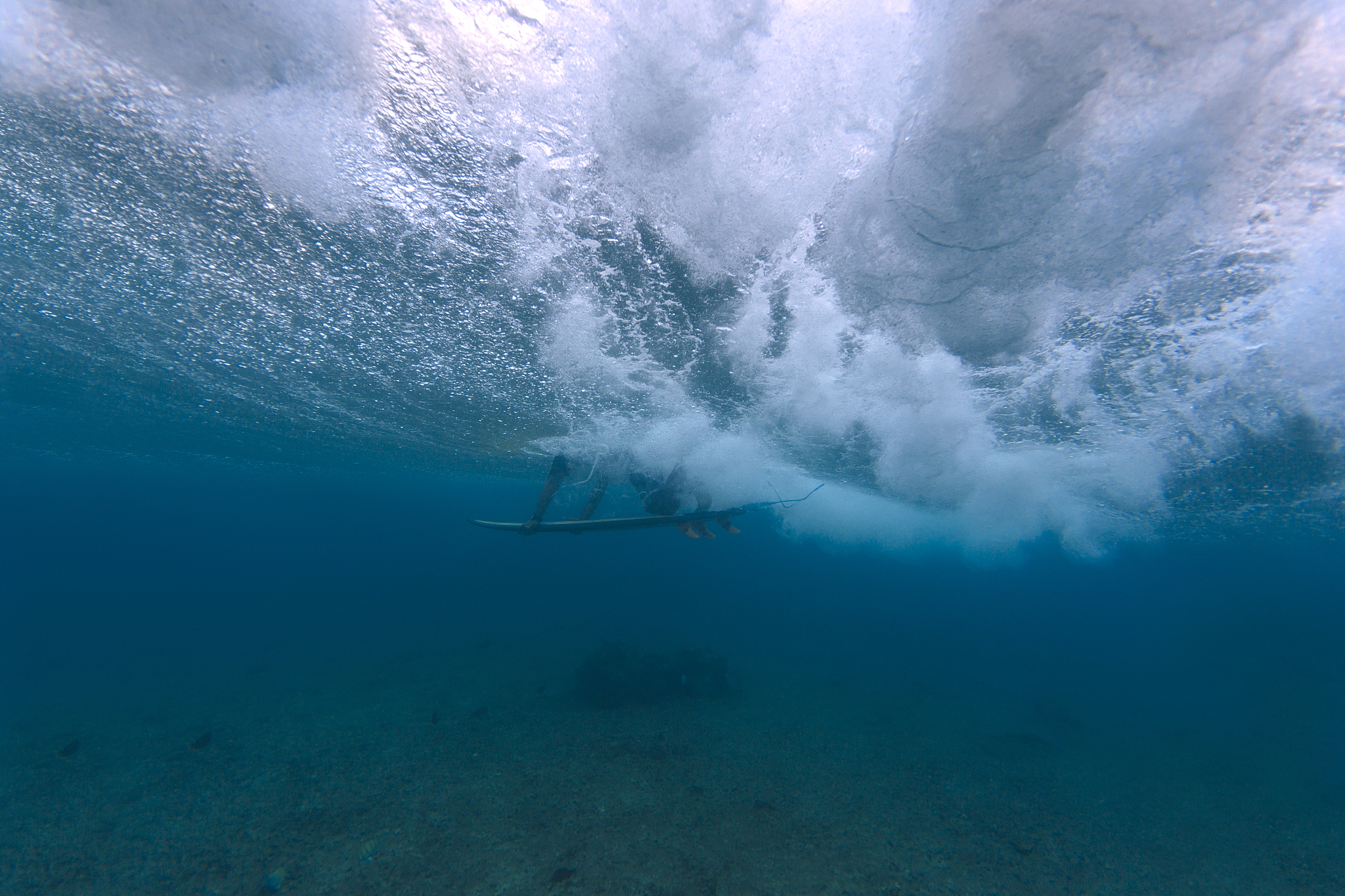 maledives, indian ocean, surfer on surfboard, underwater shot