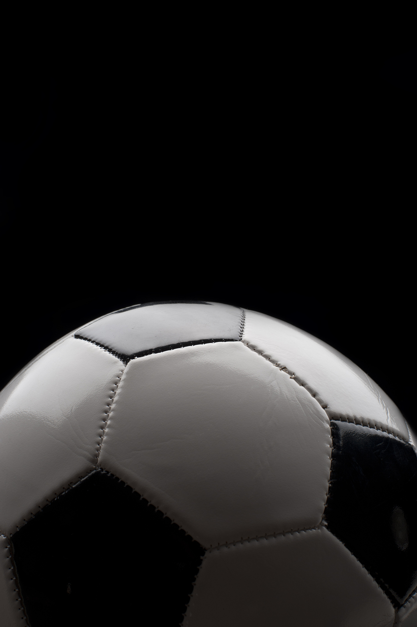 black and white leather soccer ball.