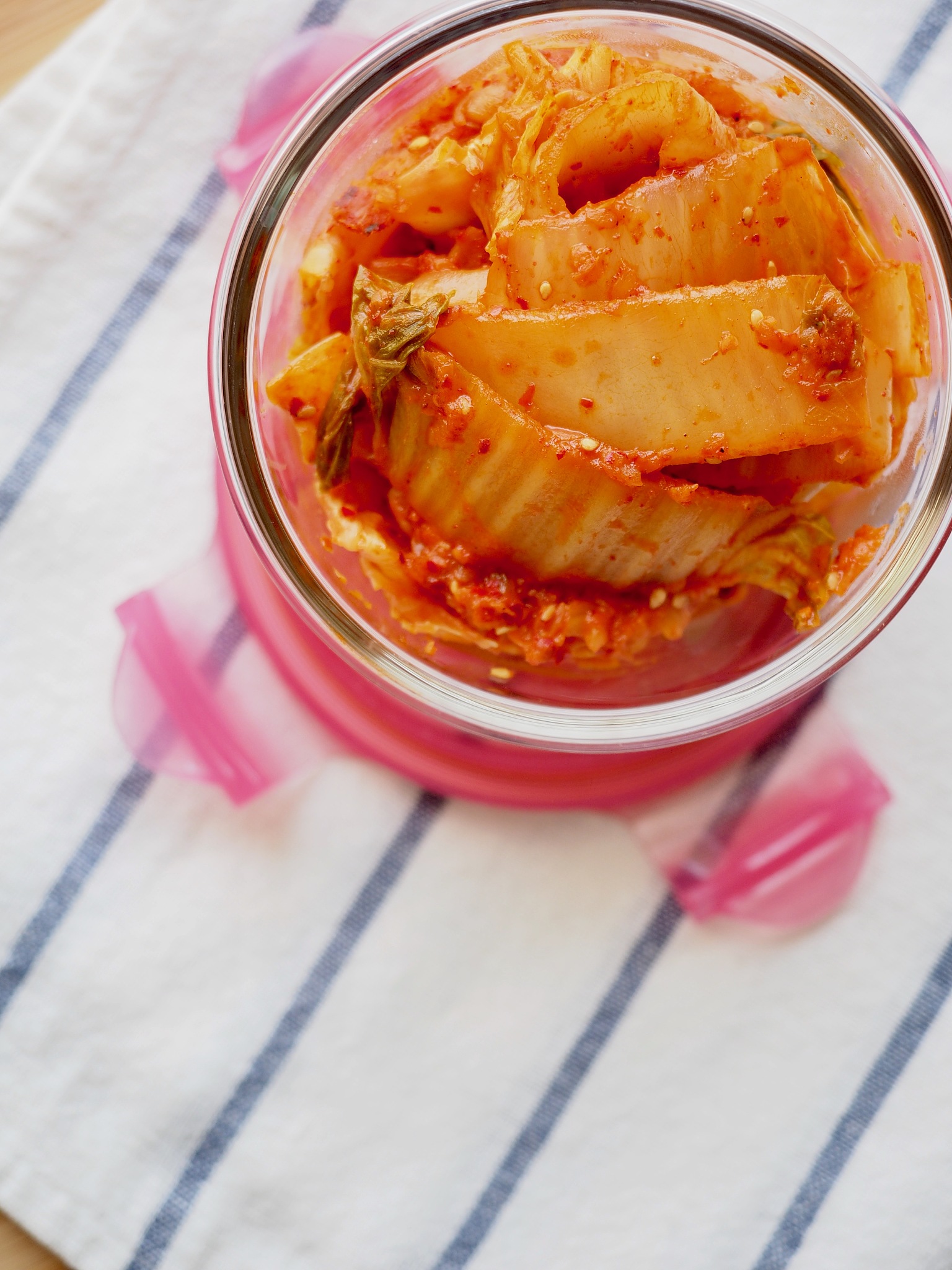korean traditional food, stir-fried kimchi in a glass container