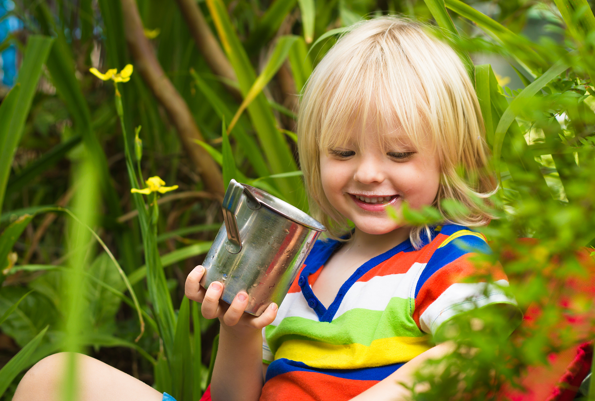 cute, happy child drinking milk outdoors