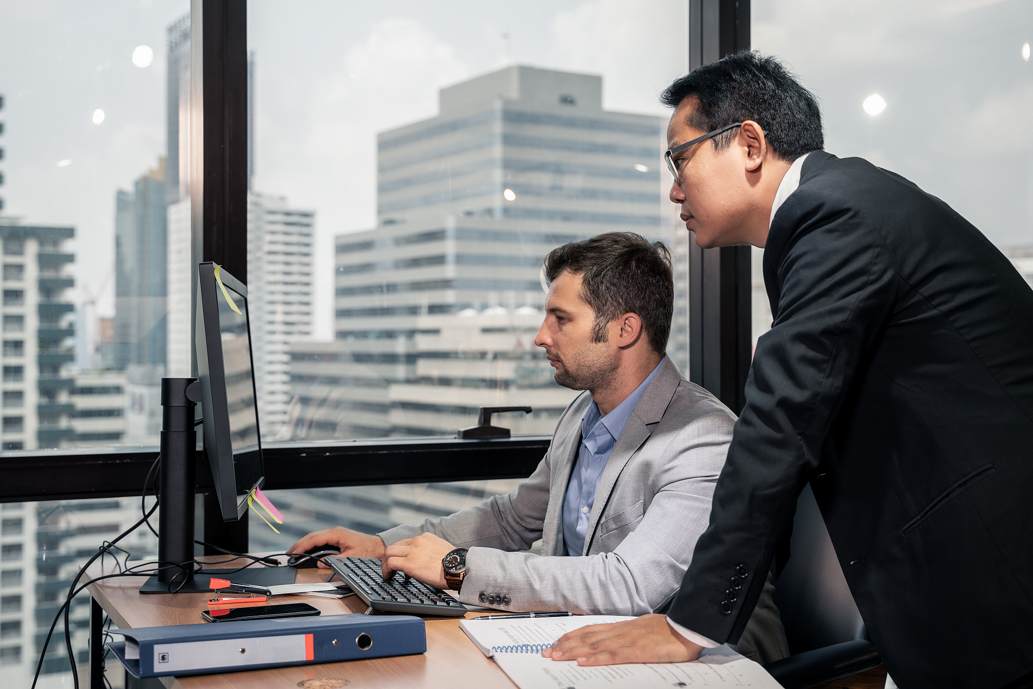 group of young business people working and communicating while s
