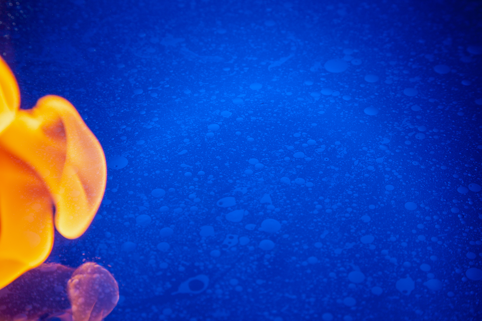blue water, cosmic patterns, oil creates space. outbreak of fire