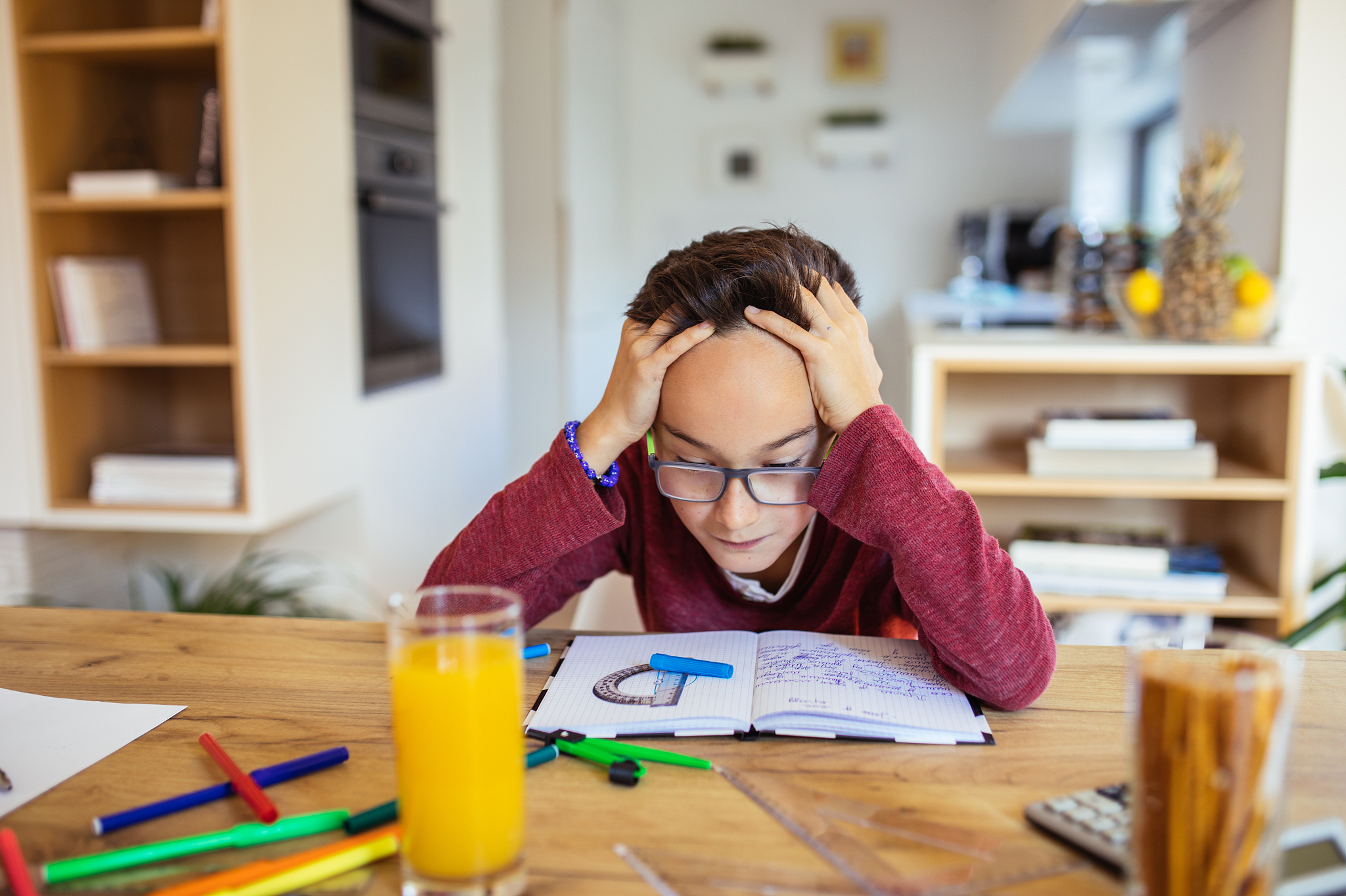 tired boy doing homework