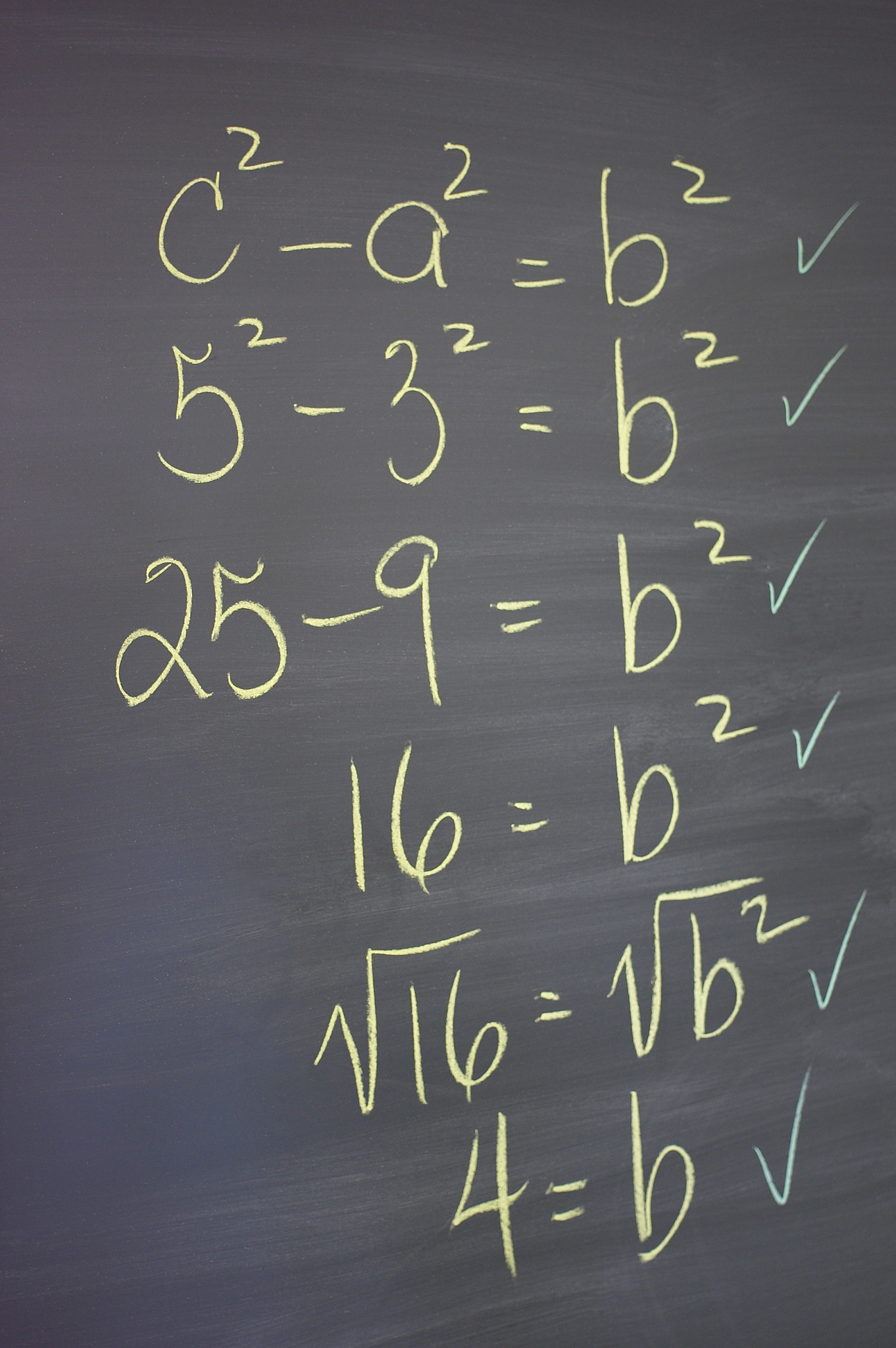 algebra equations on chalkboard