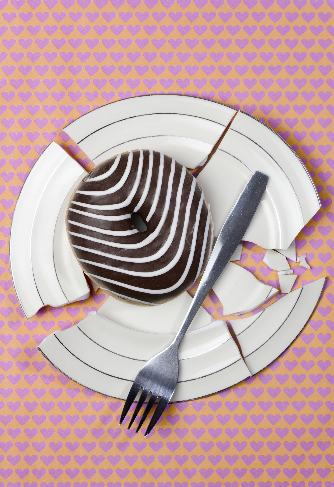 chocolate donut on broken plate