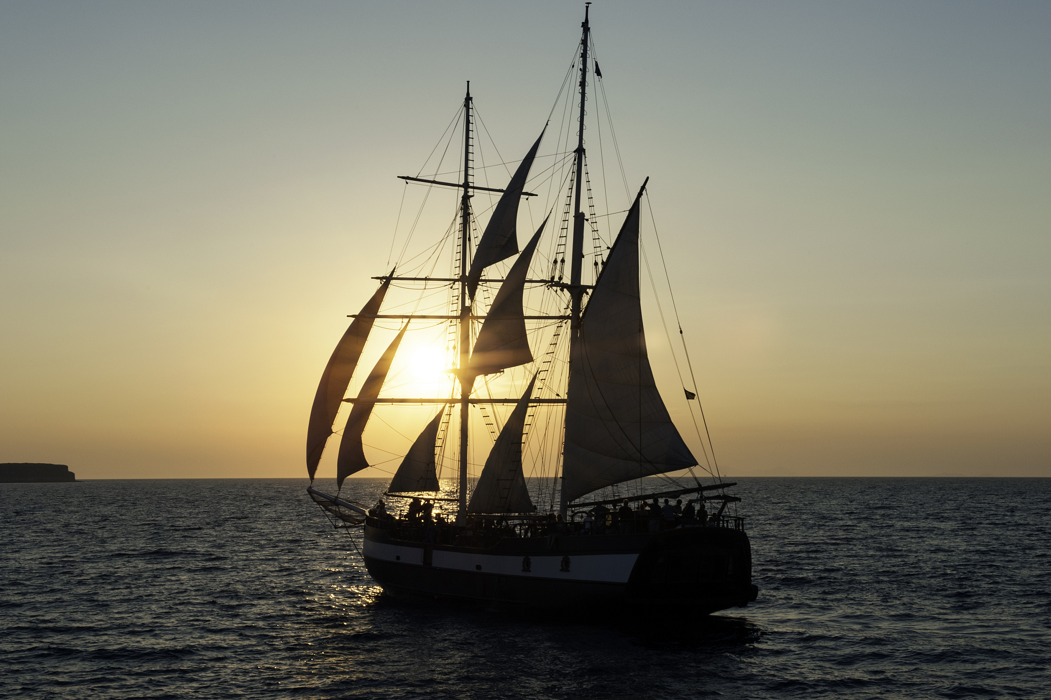 sailboat in sea at sunset, santorini, greece