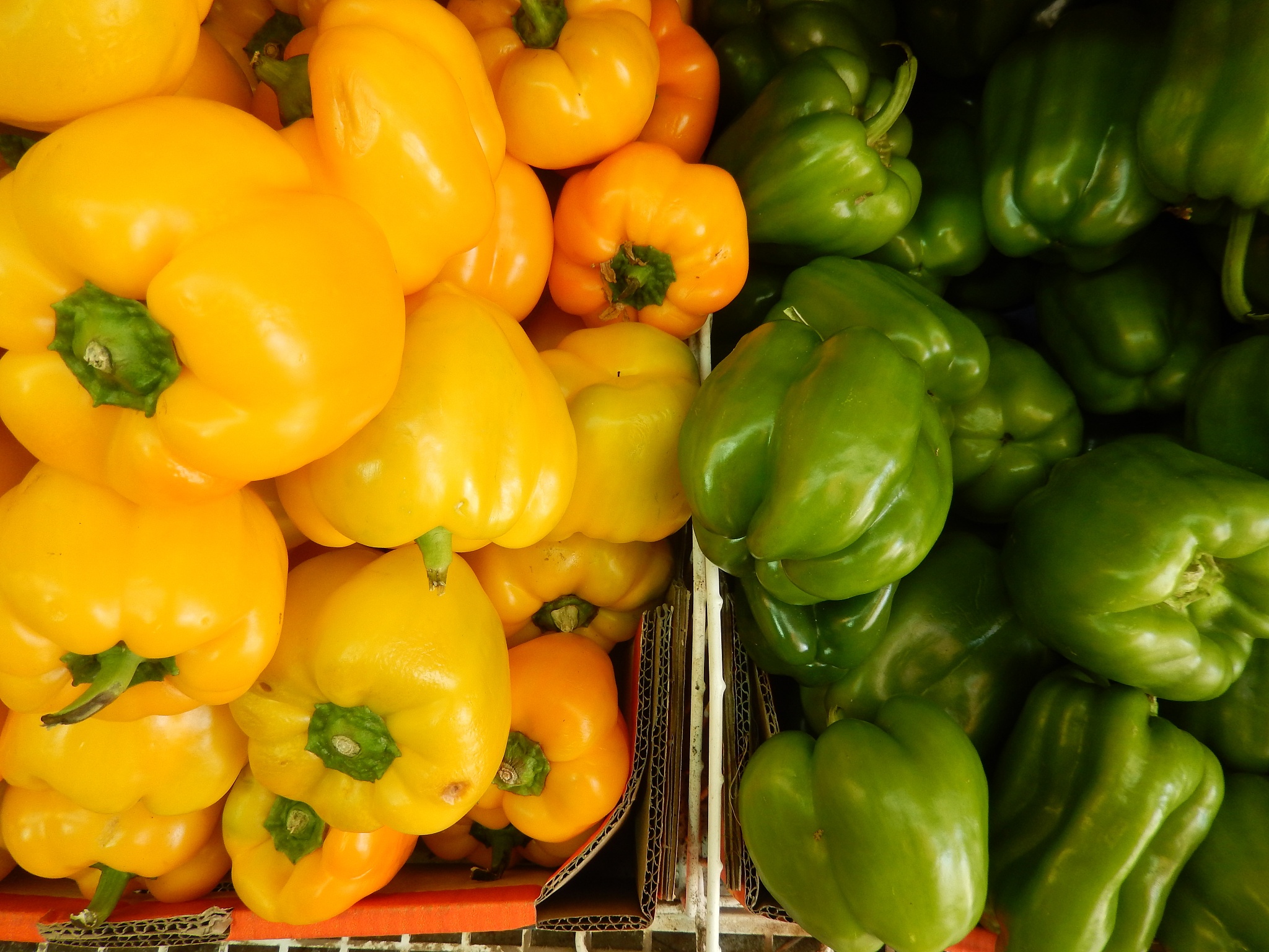 yellow and green peppers at the market