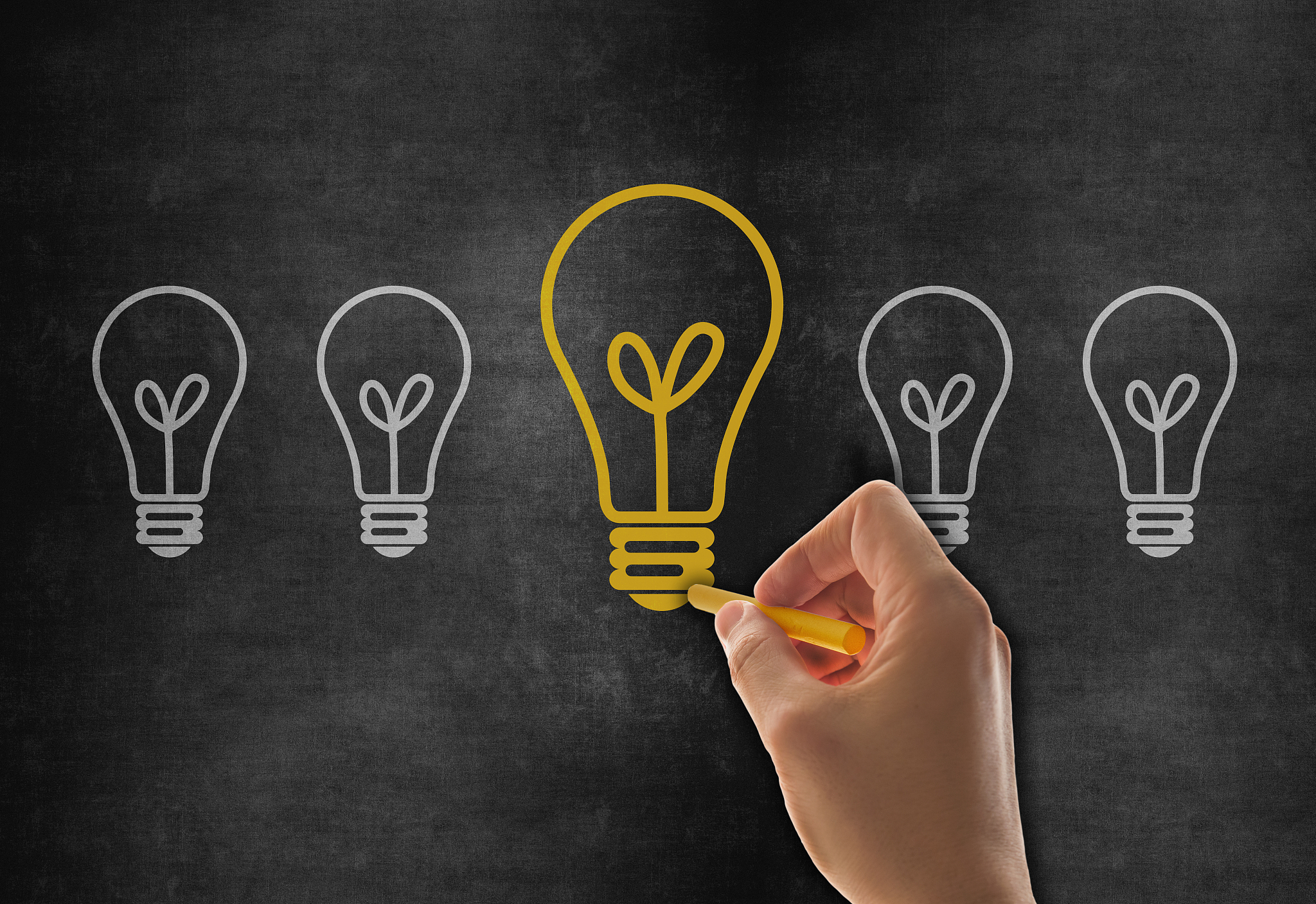 hand drawing big idea light bulb on blackboard