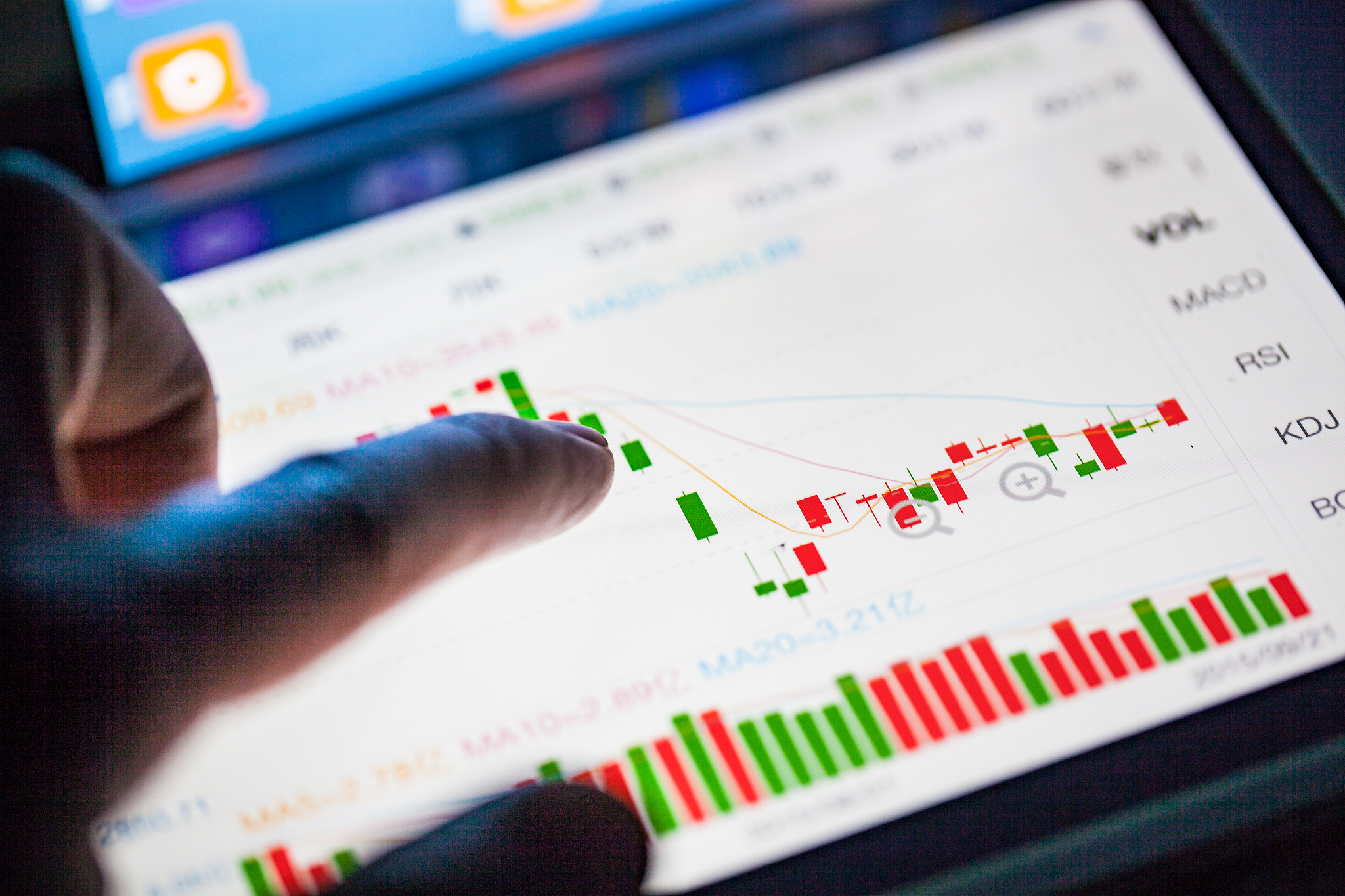 finger  pointing to the market data
