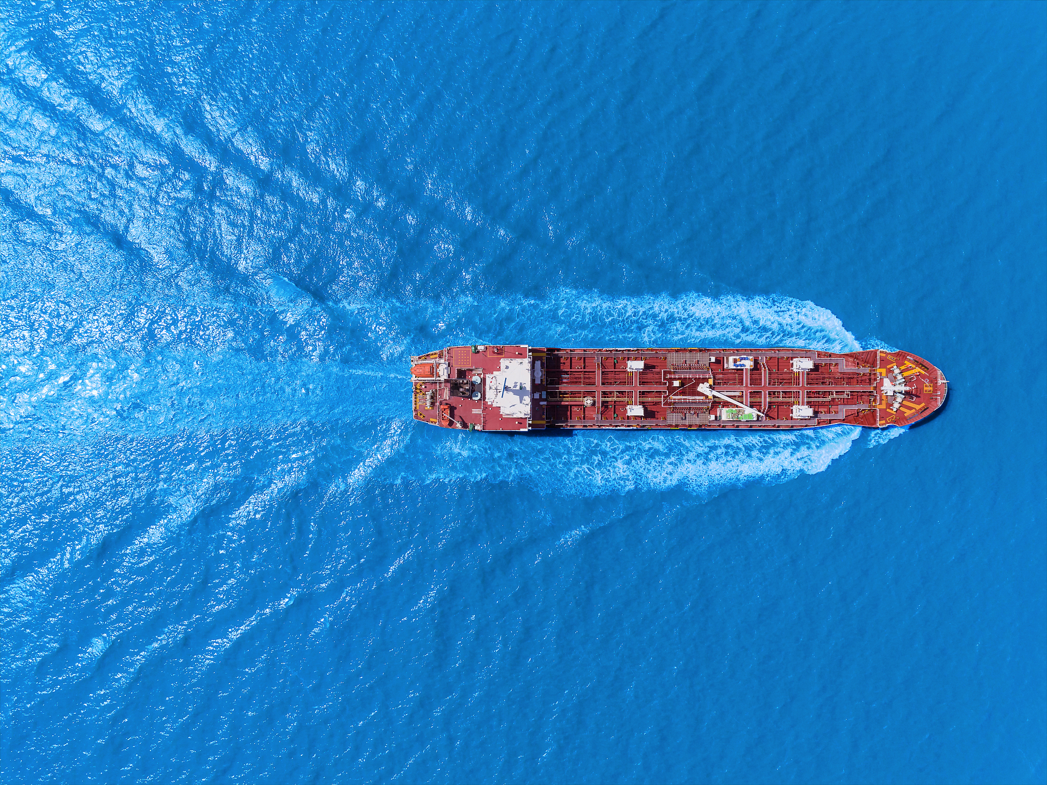 aerial top view oil ship tanker full speed with beautiful wave p