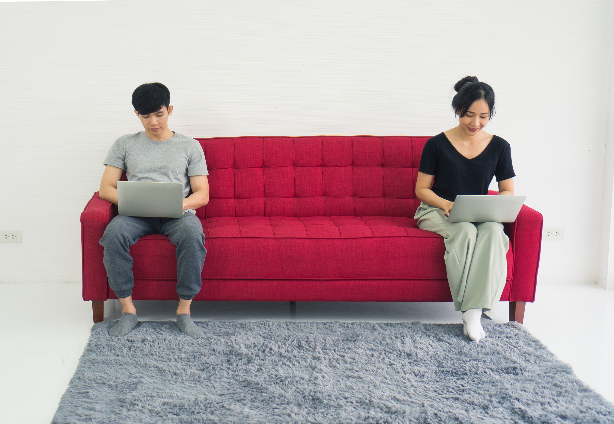 young asian couple love man and woman working at home keep dista