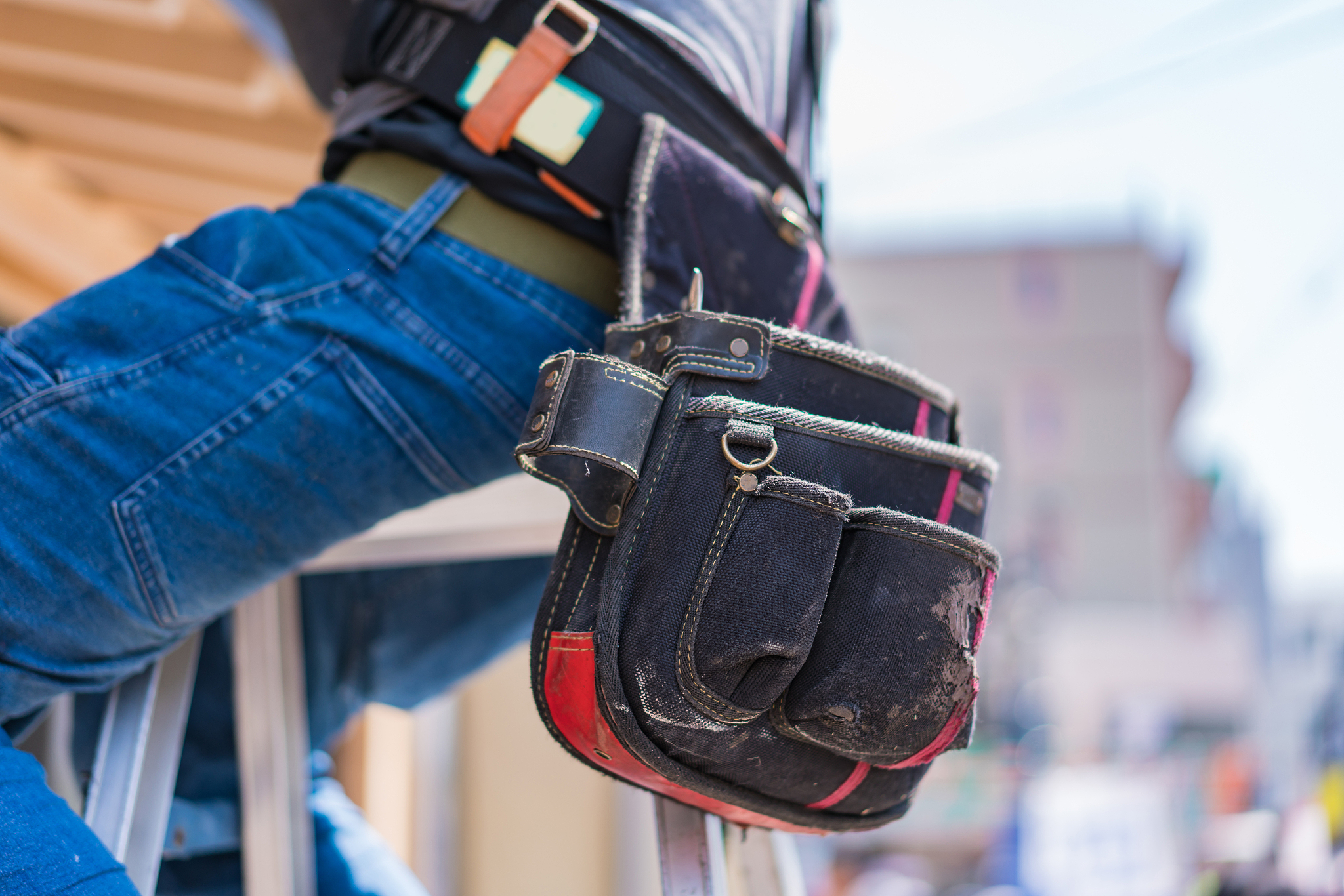 man with bag working outdoors