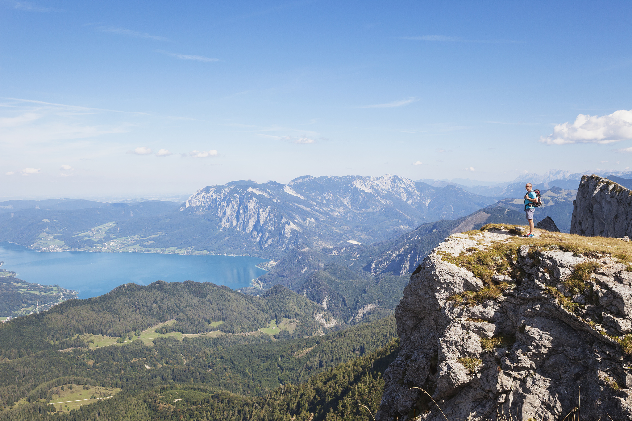 full length of hiker standing on spinnerin peak while looking at