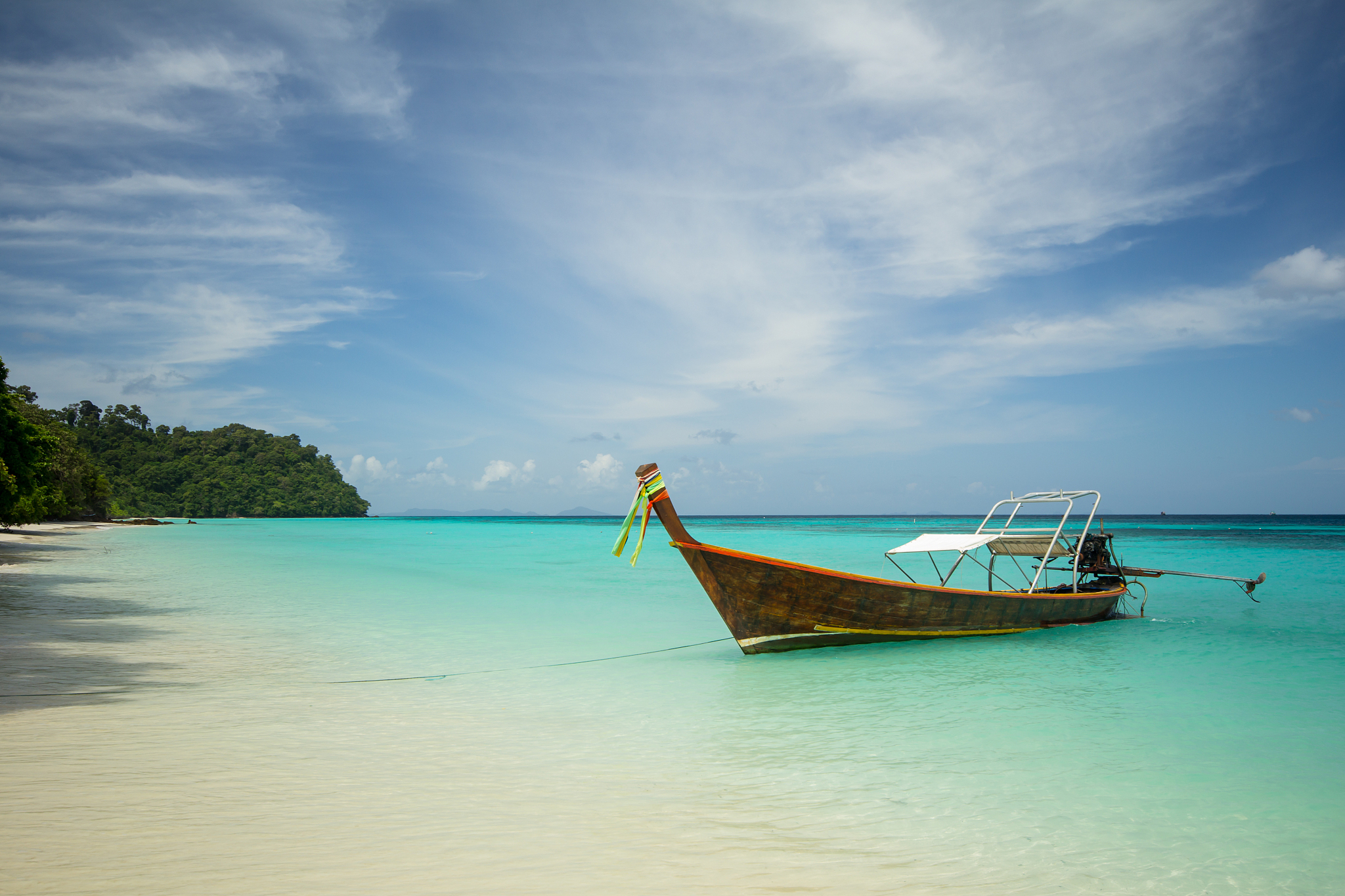 long boat with blue sky