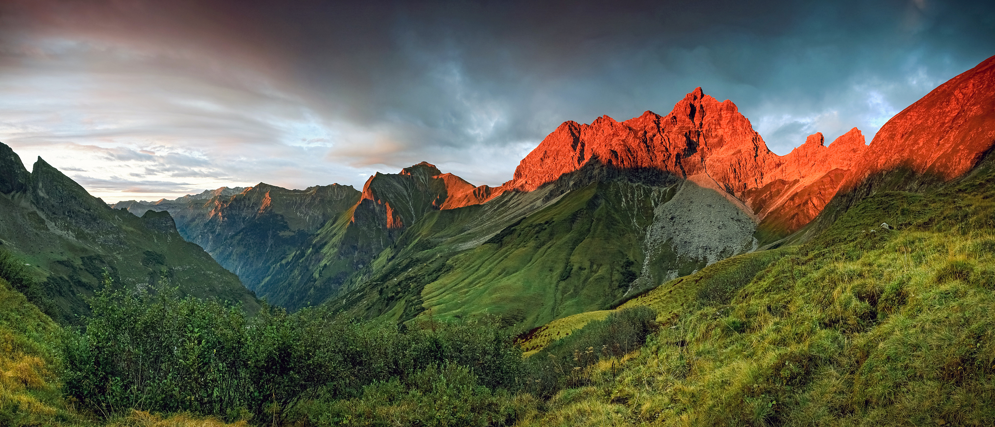 amazing sunset and red afterglow in high mountains.