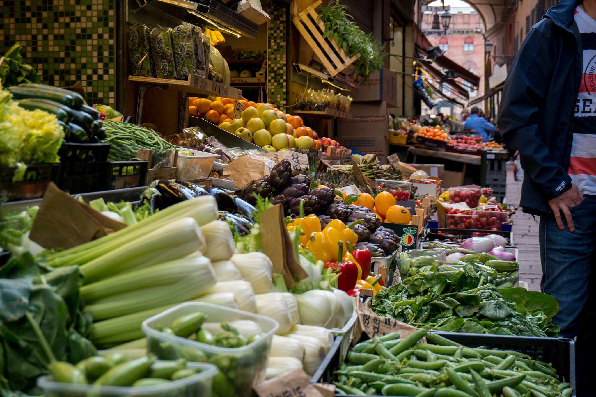 midsection of man standing by vegetable market stall