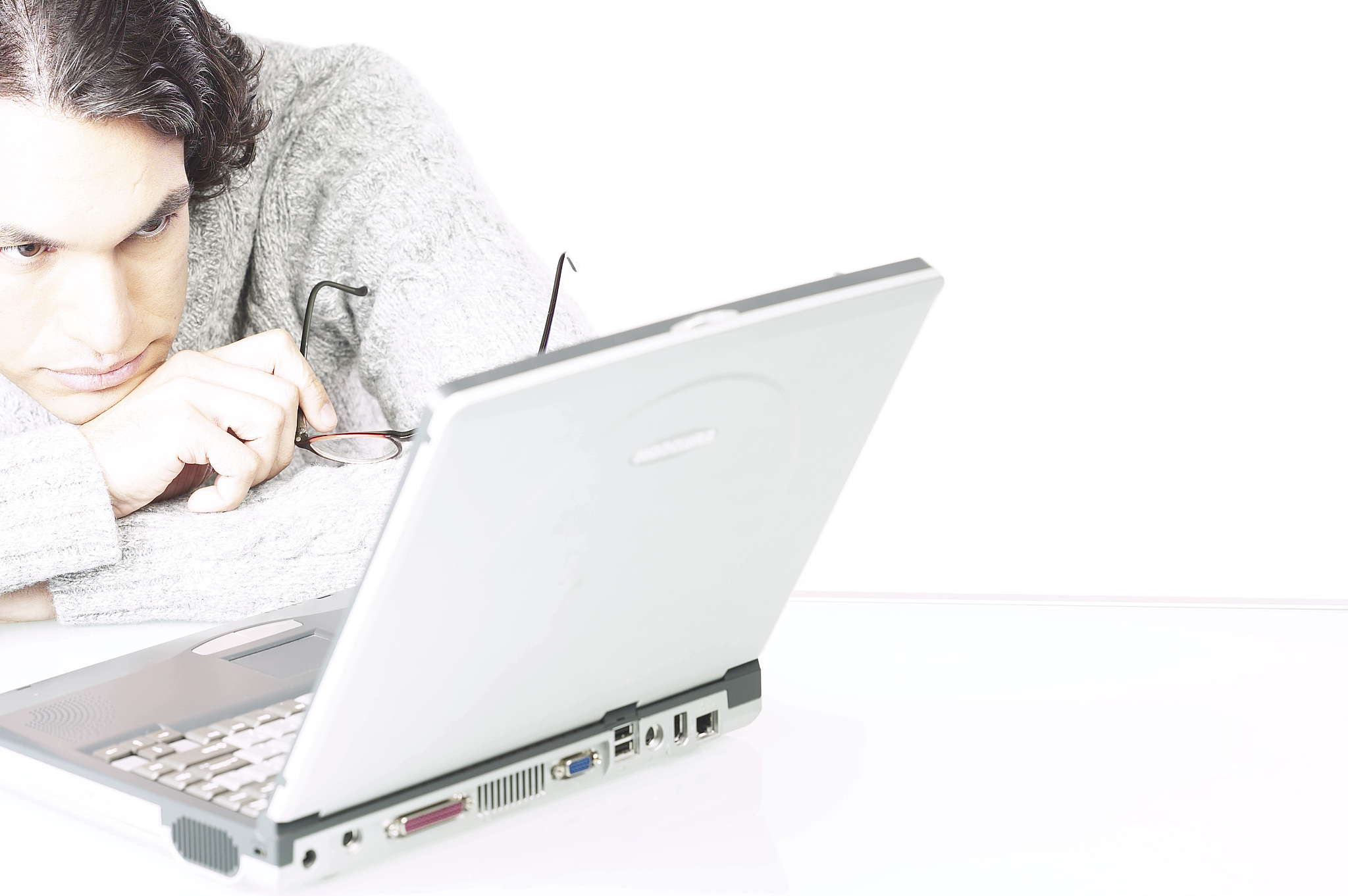 man reading computer screen