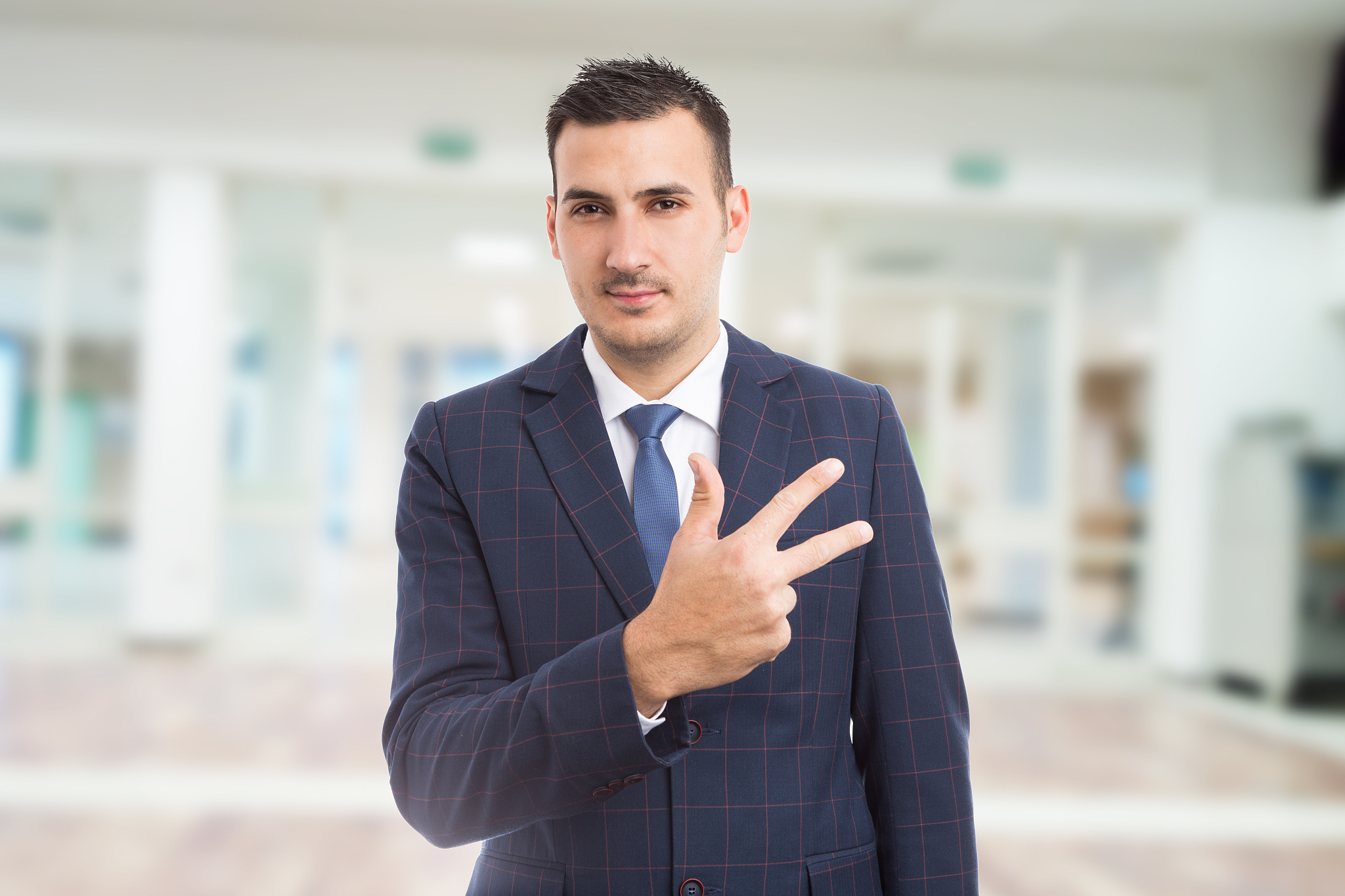 real estate manager showing number three or third