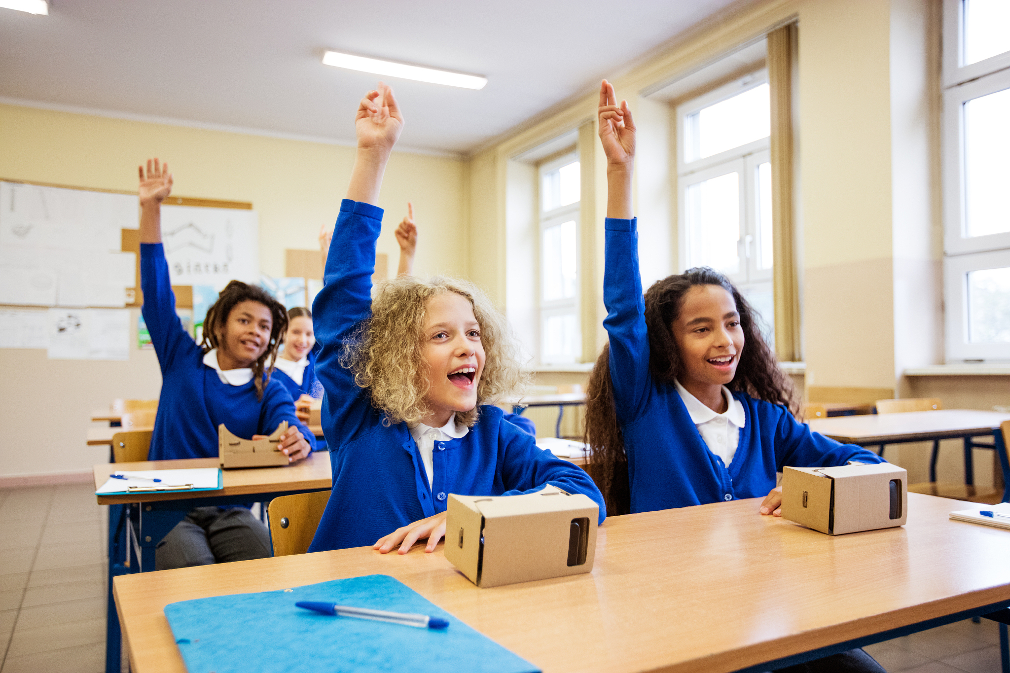 school kids using virtual reality goggles