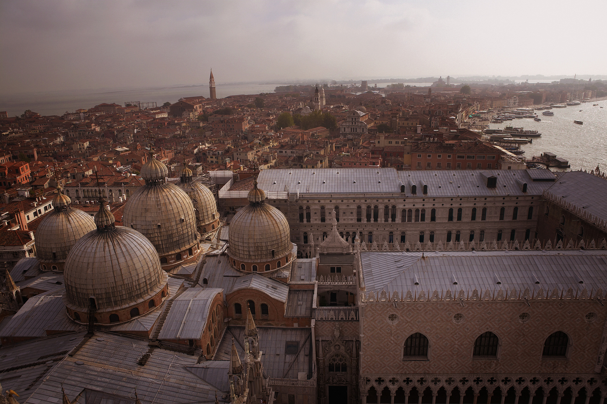 view over the rooftops of venice, italy, with the doges palace i