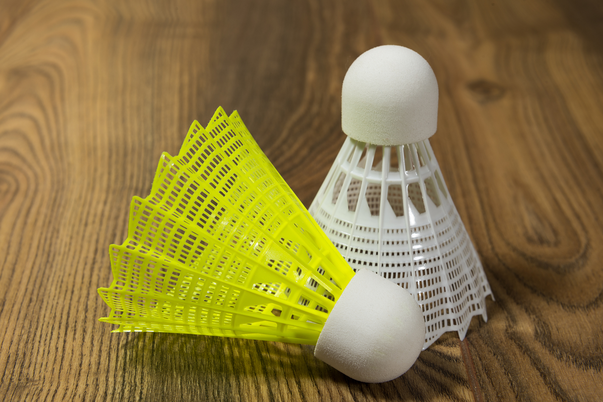 shuttlecocks for badminton on a wooden floor