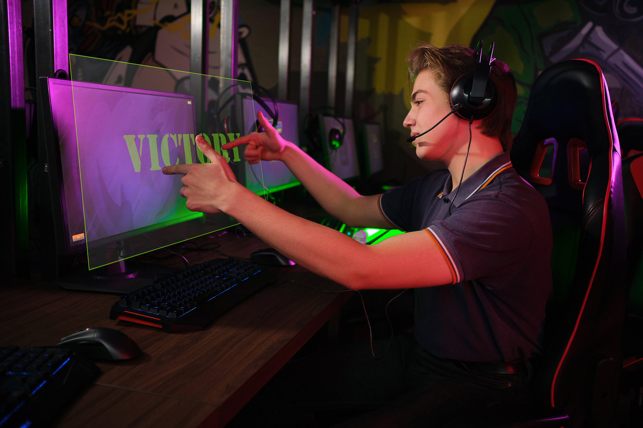 professional young caucasian gamer playing online on his pc. he 
