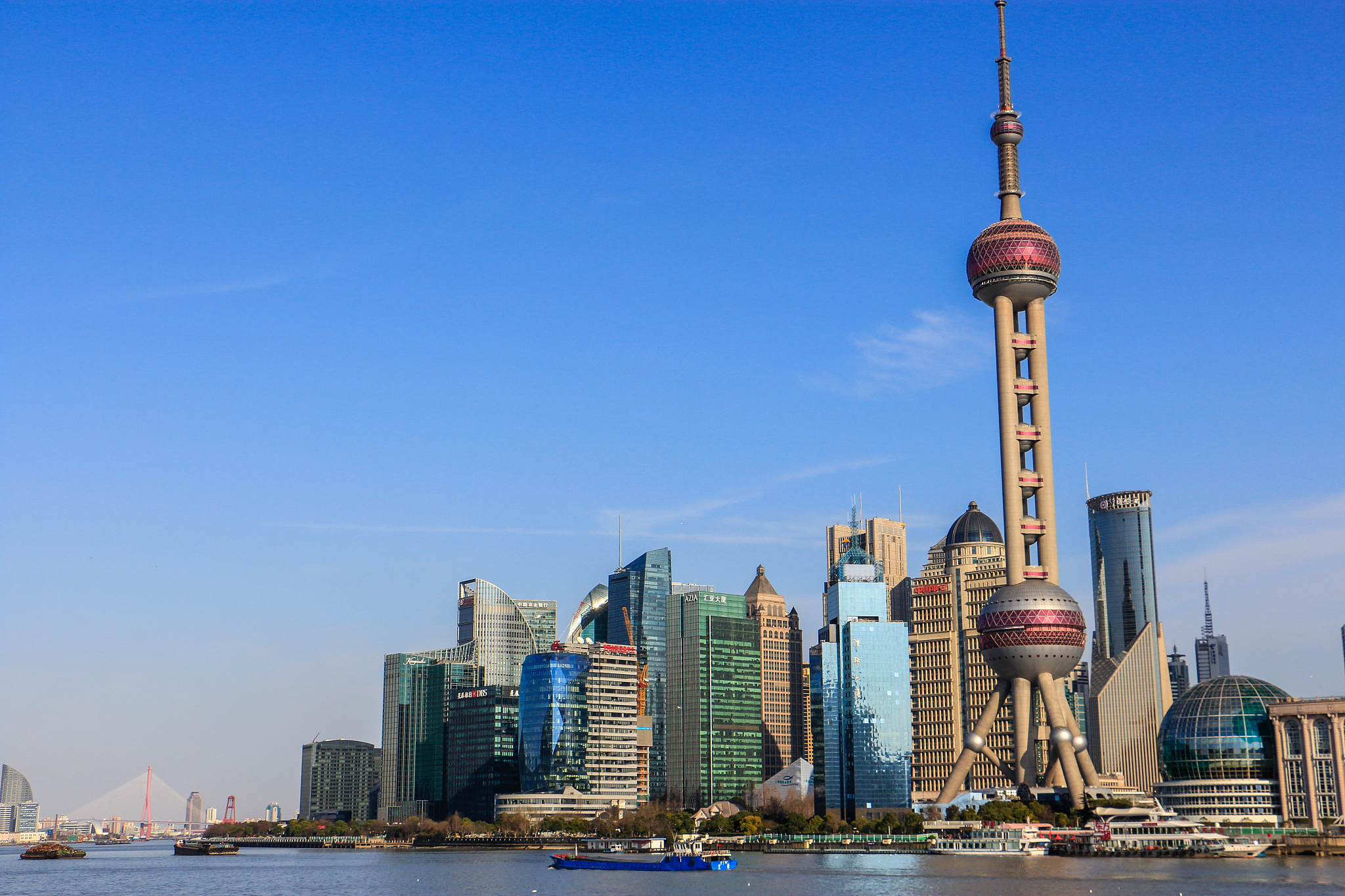 city at waterfront against blue sky