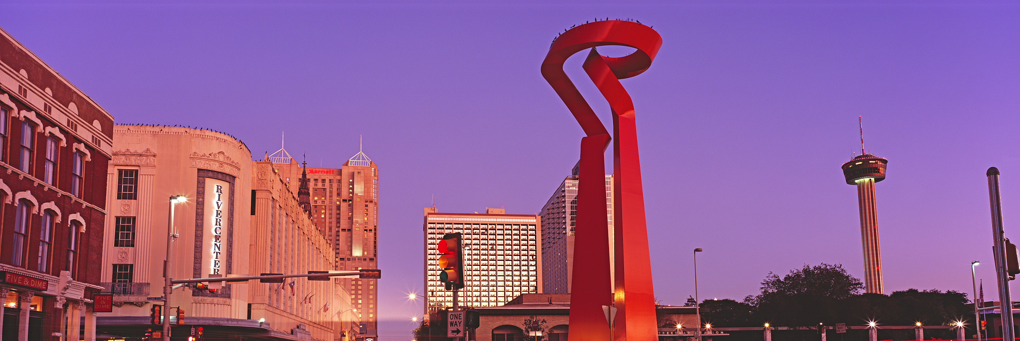 buildings in a city at dusk