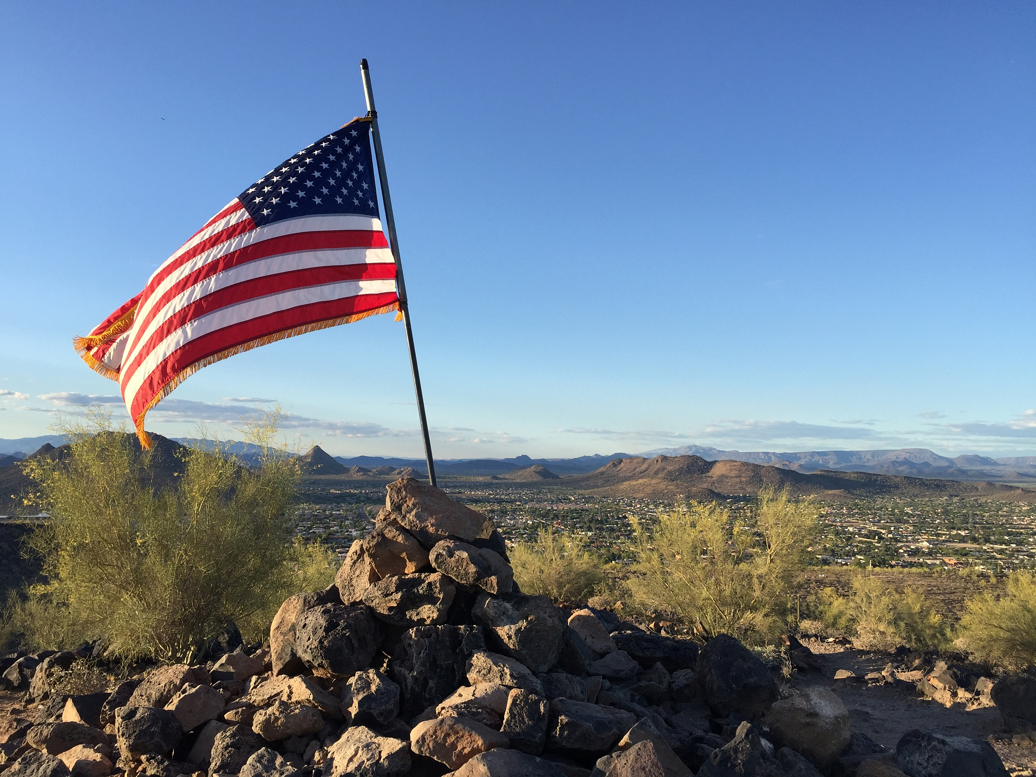american flag on desert hill