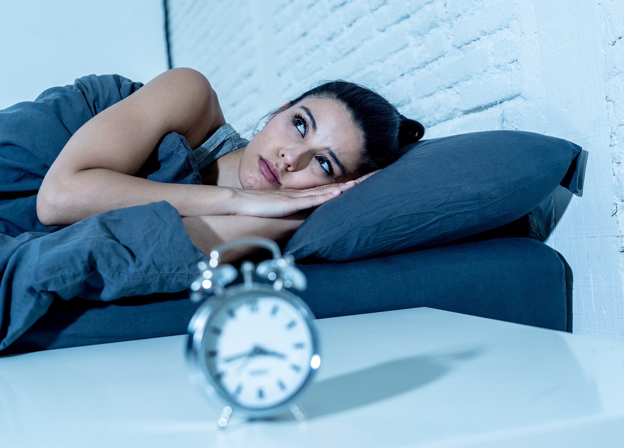 sleepless and desperate beautiful latin woman awake at night not