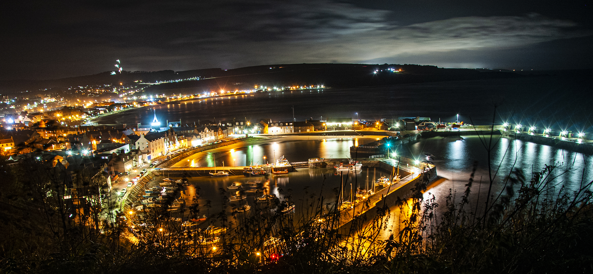 high angle view of illuminated cityscape at night
