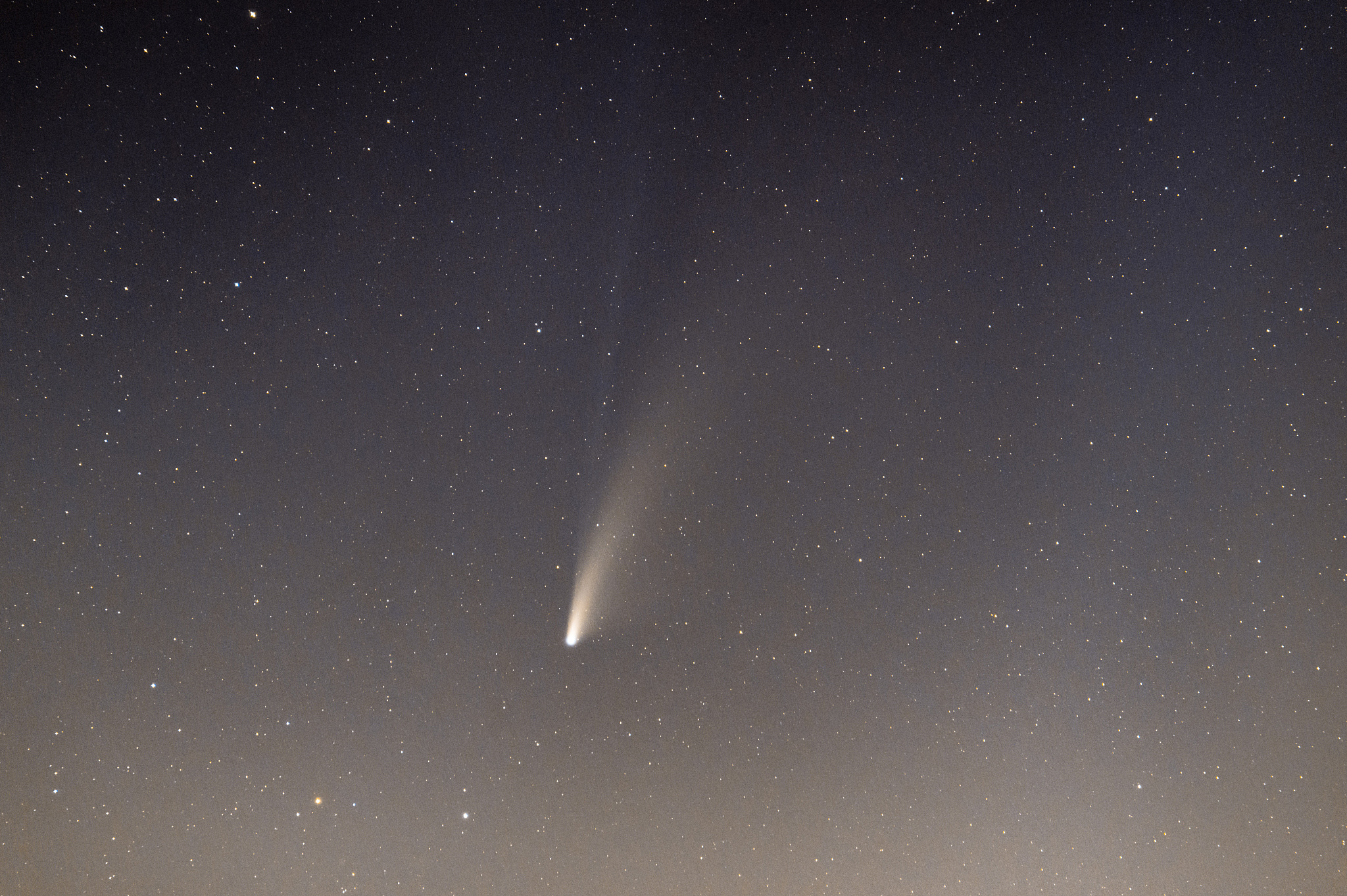 neowise comet and its long dust tail after dusk