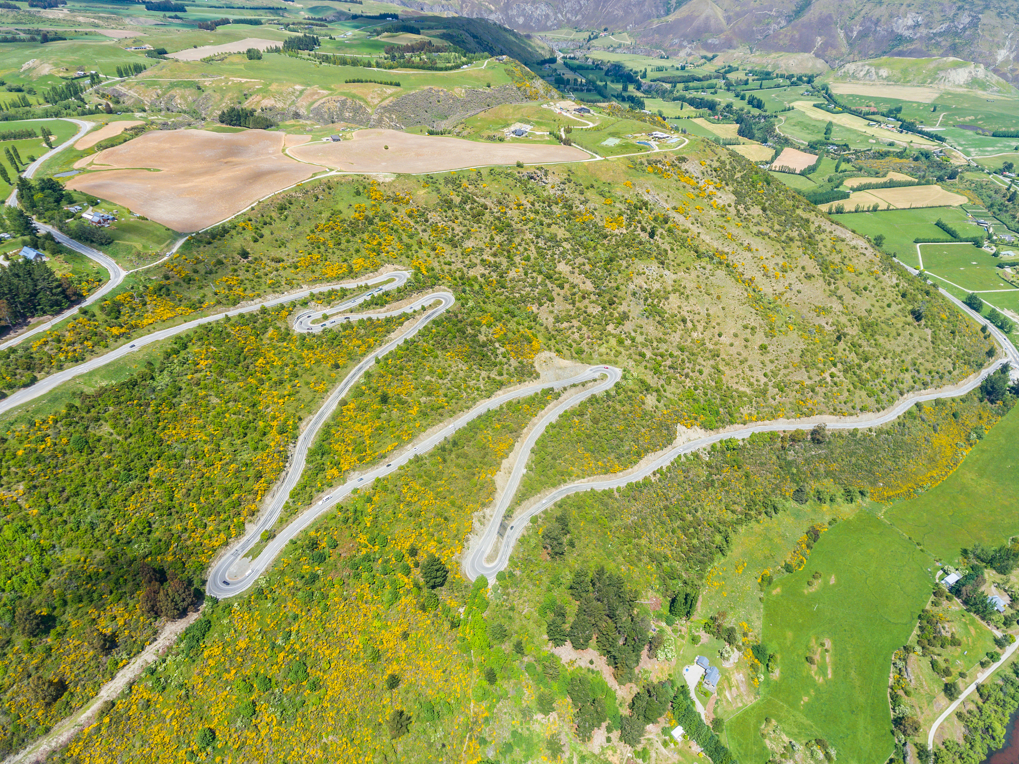 winding road on mountain, queenstown, new zealand