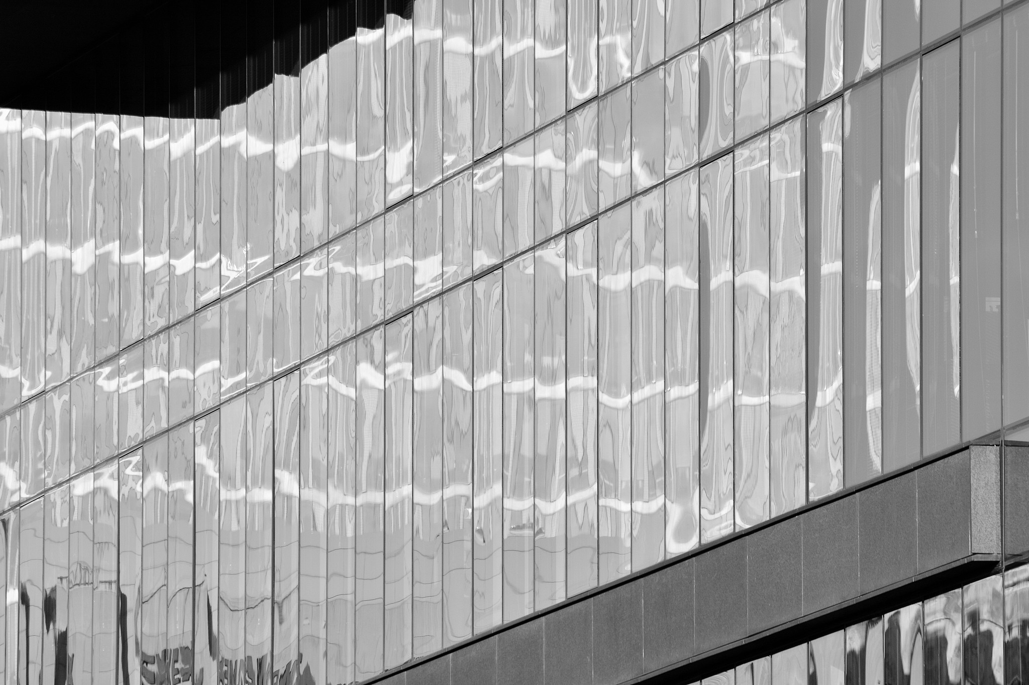 modern office building wall made of steel and glass. black and w