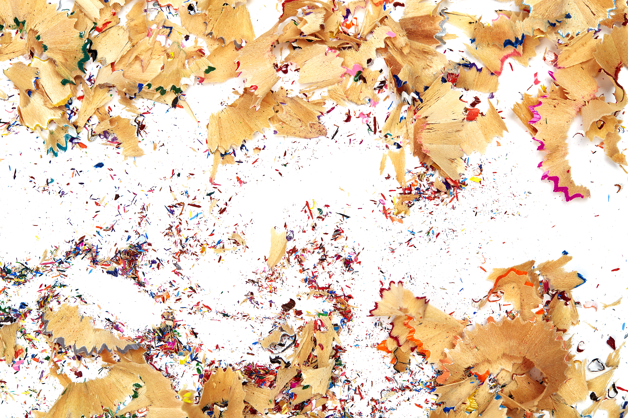 shavings from multicolored pencils on white