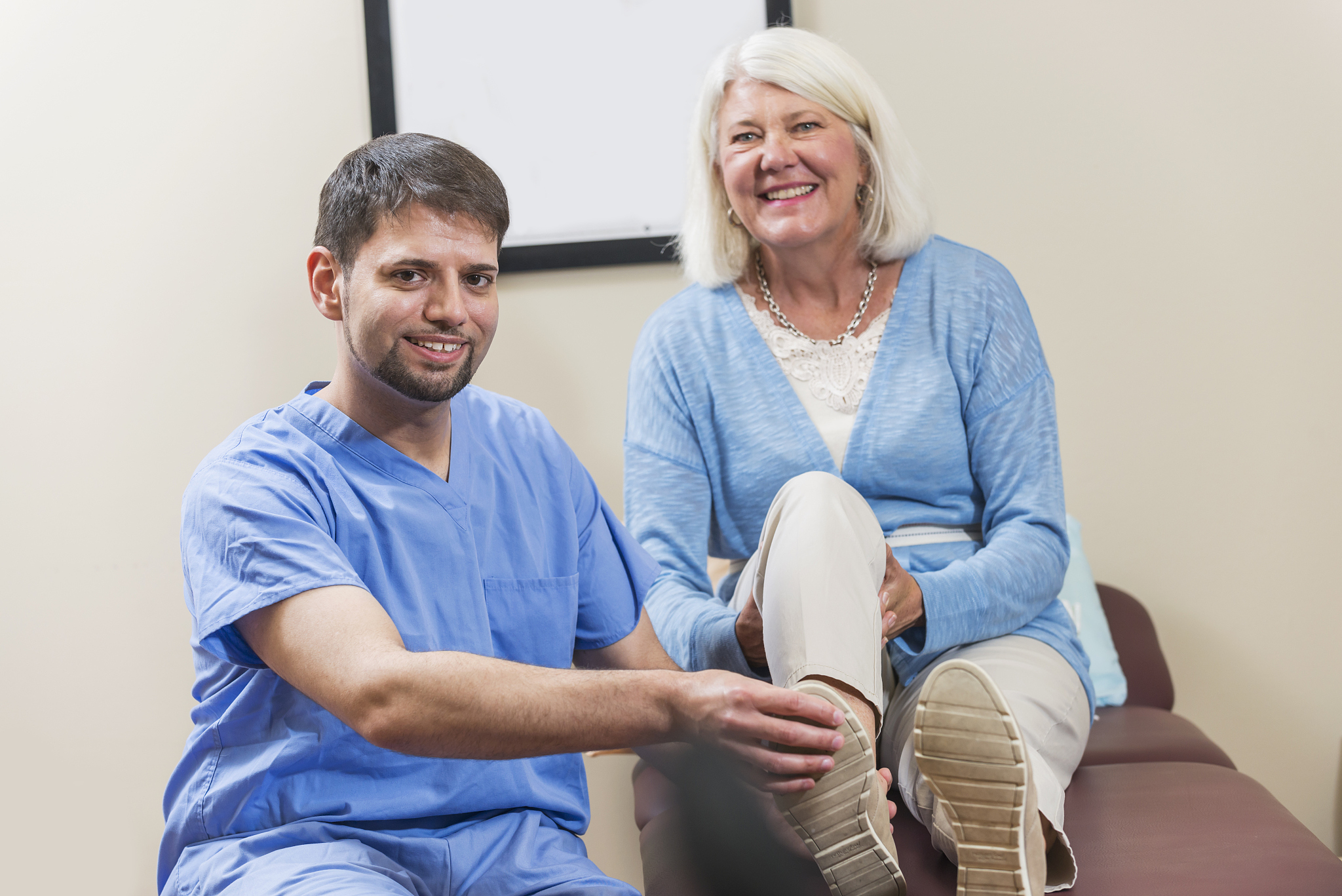 mature woman with physical therapist