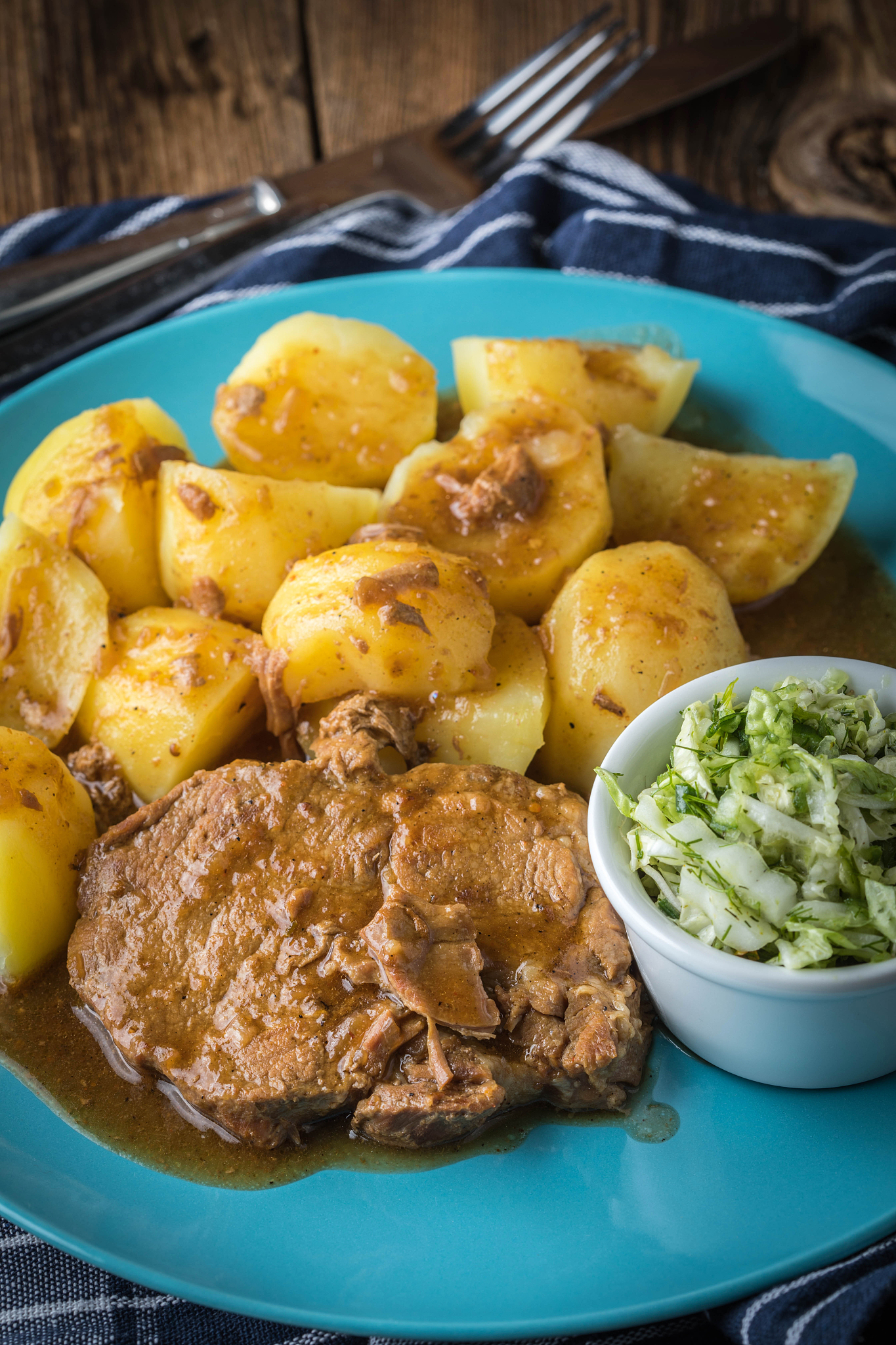 braised meat in sauce served with boiled potatoes.