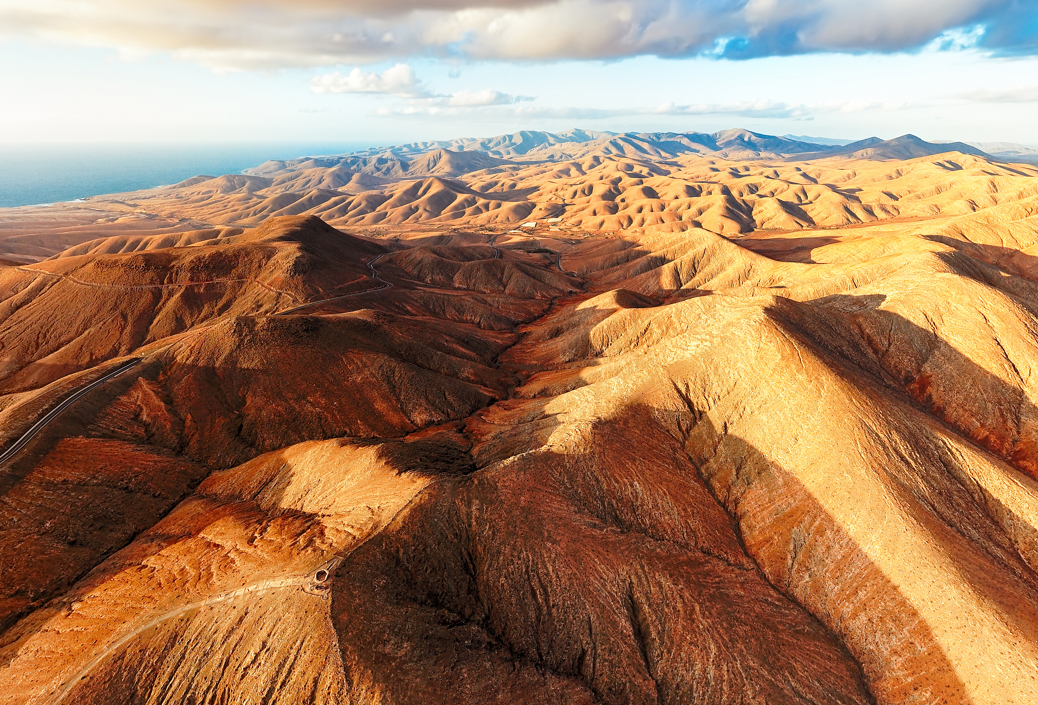 sunset over desert landscape of fuerteventura, canary islands