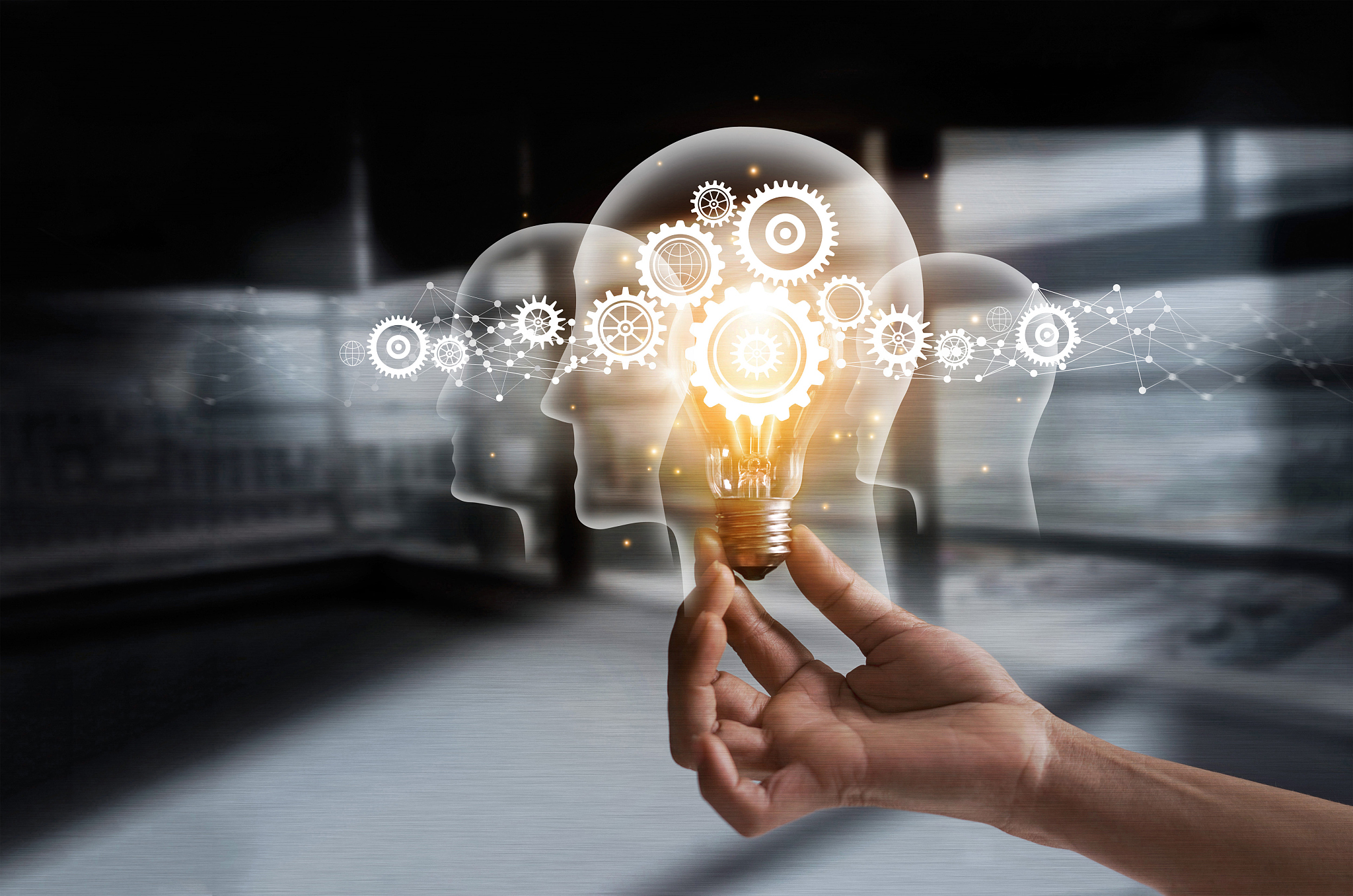 hand holding light bulb and cog inside. idea and imagination. cr