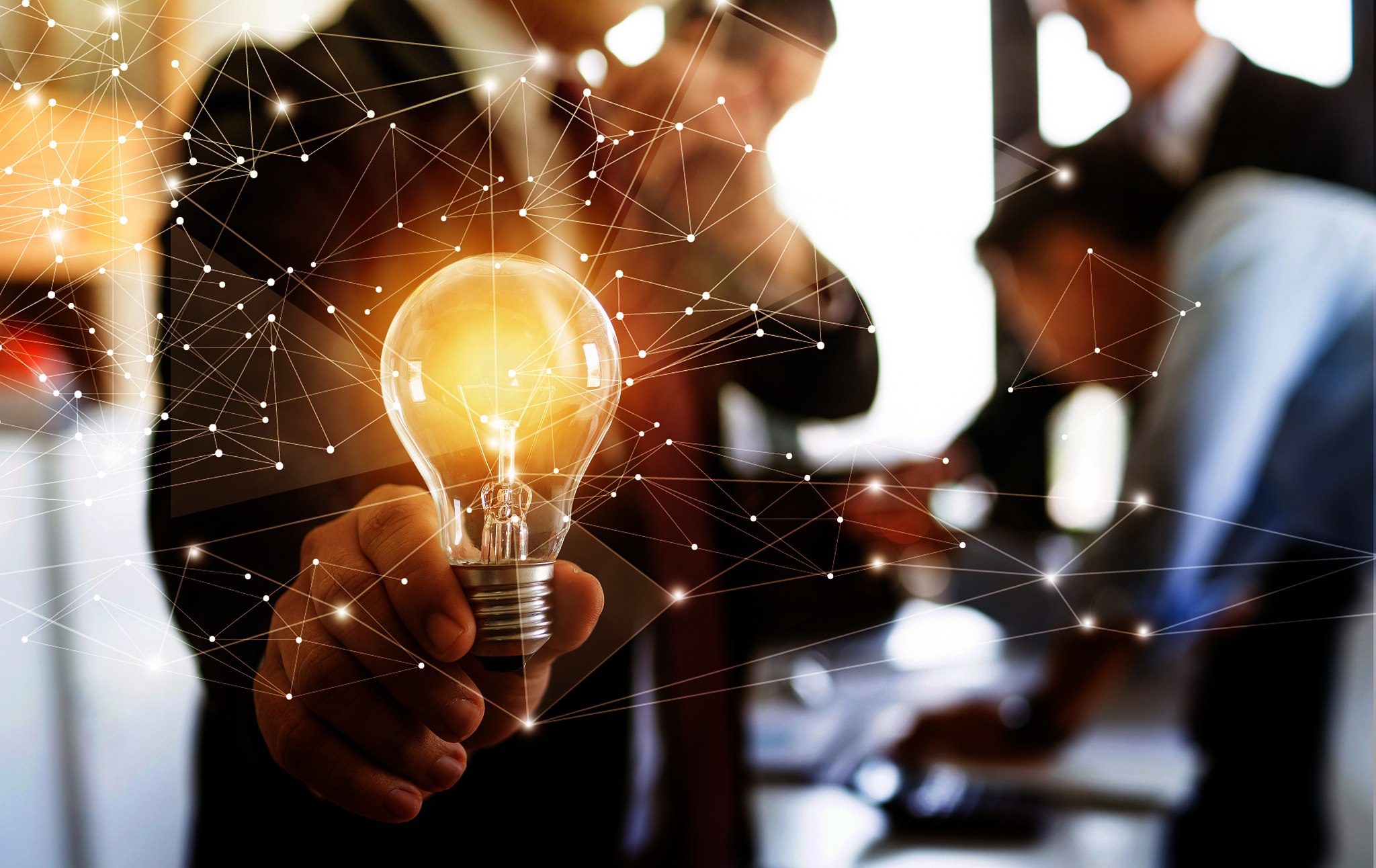 innovation and idea of professional leader holding lighting bulb