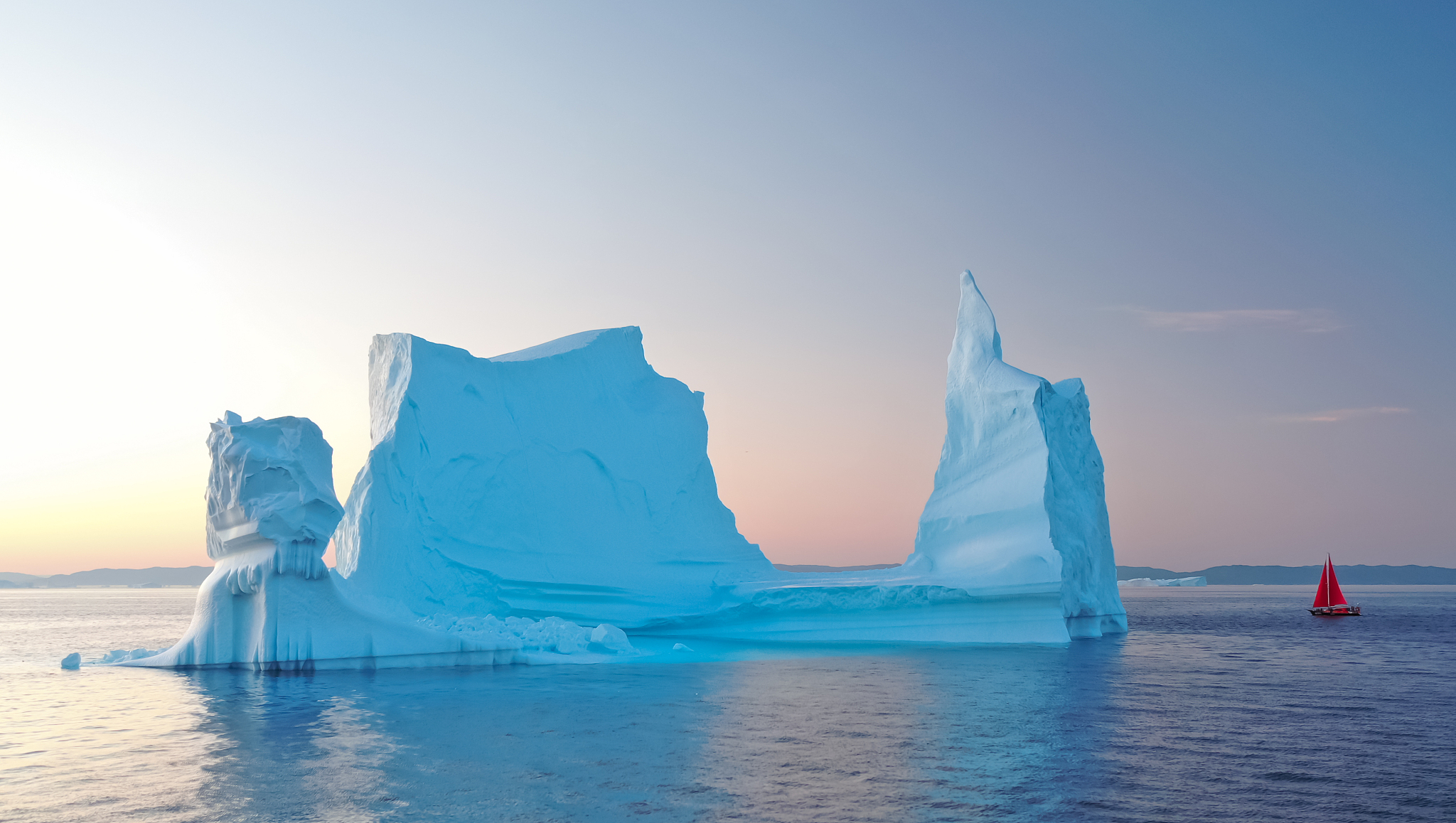 aerial view of large glacier and iceberg