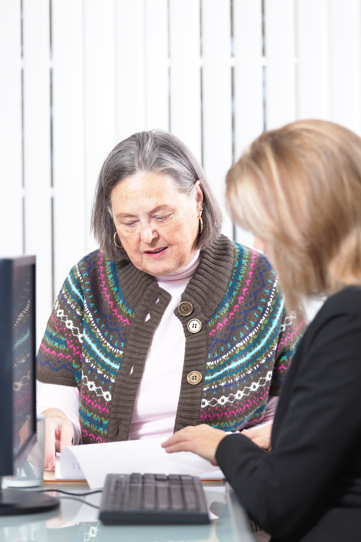 senior woman consulting banking and financial advisor vt
