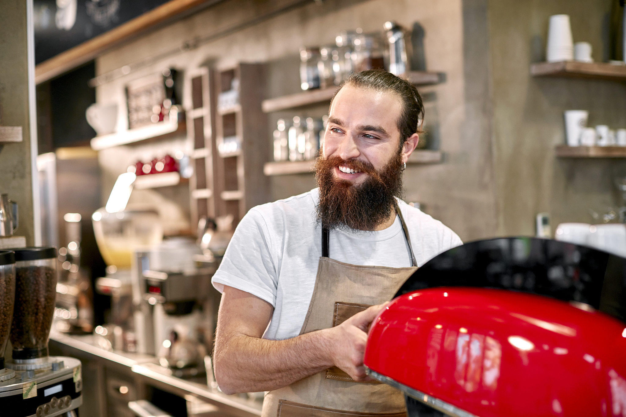 barista making a latte