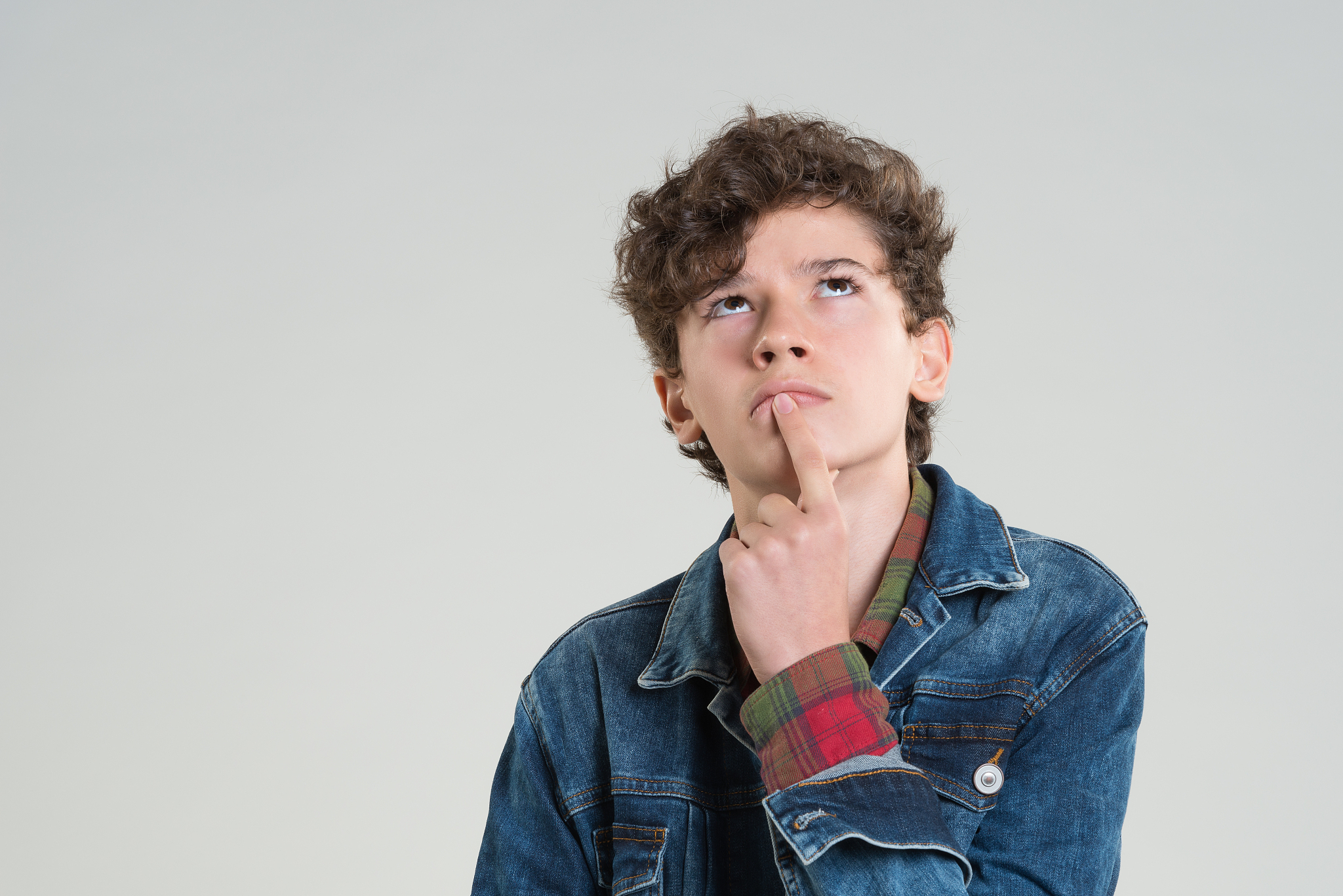 young boy thinking