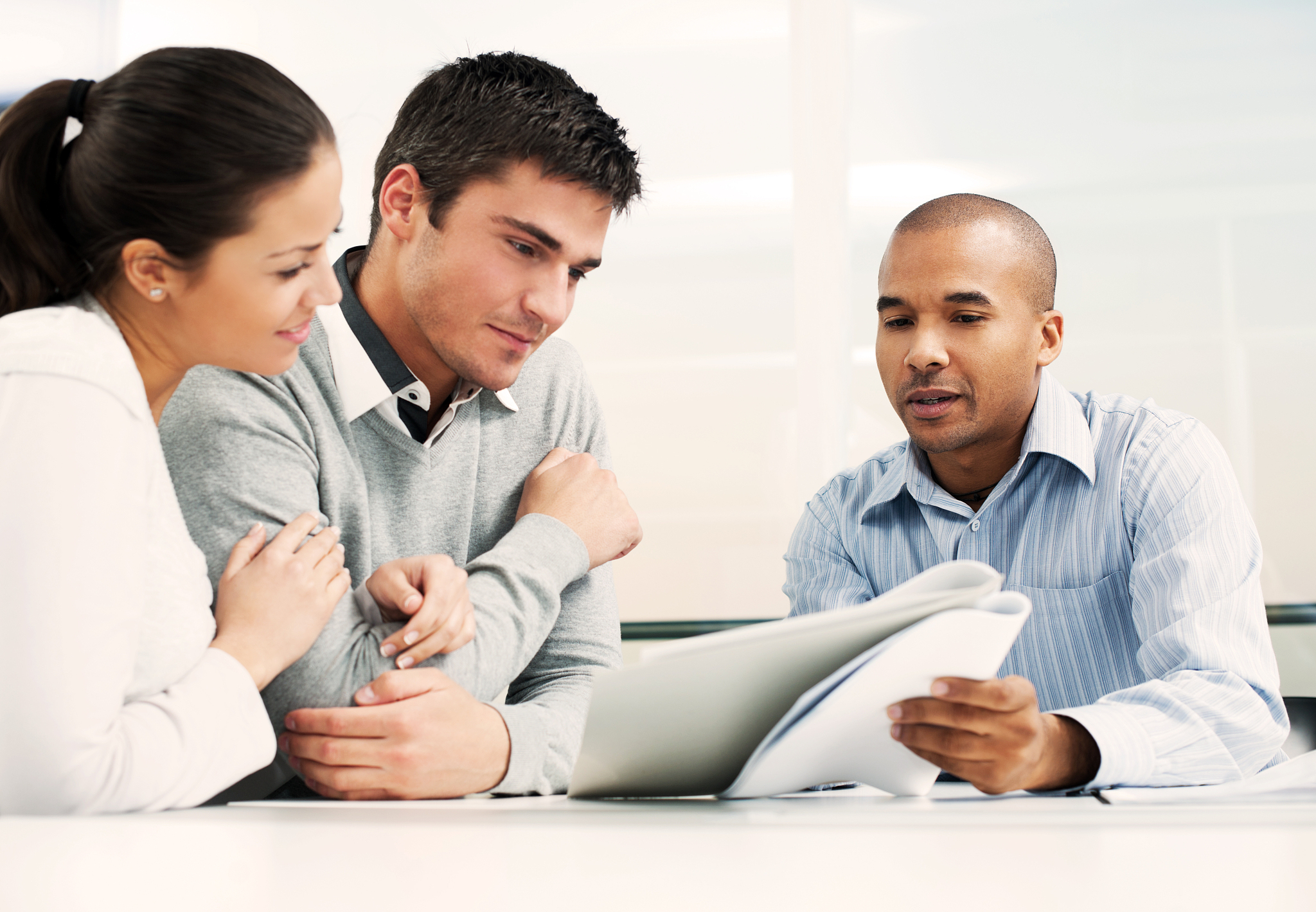 couple meeting with financial advisor.