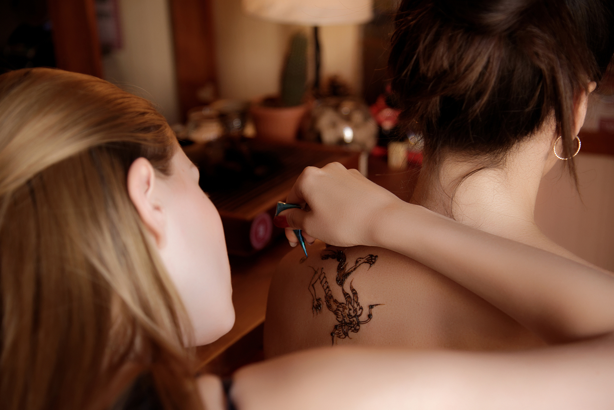 artist performing mehendi painting