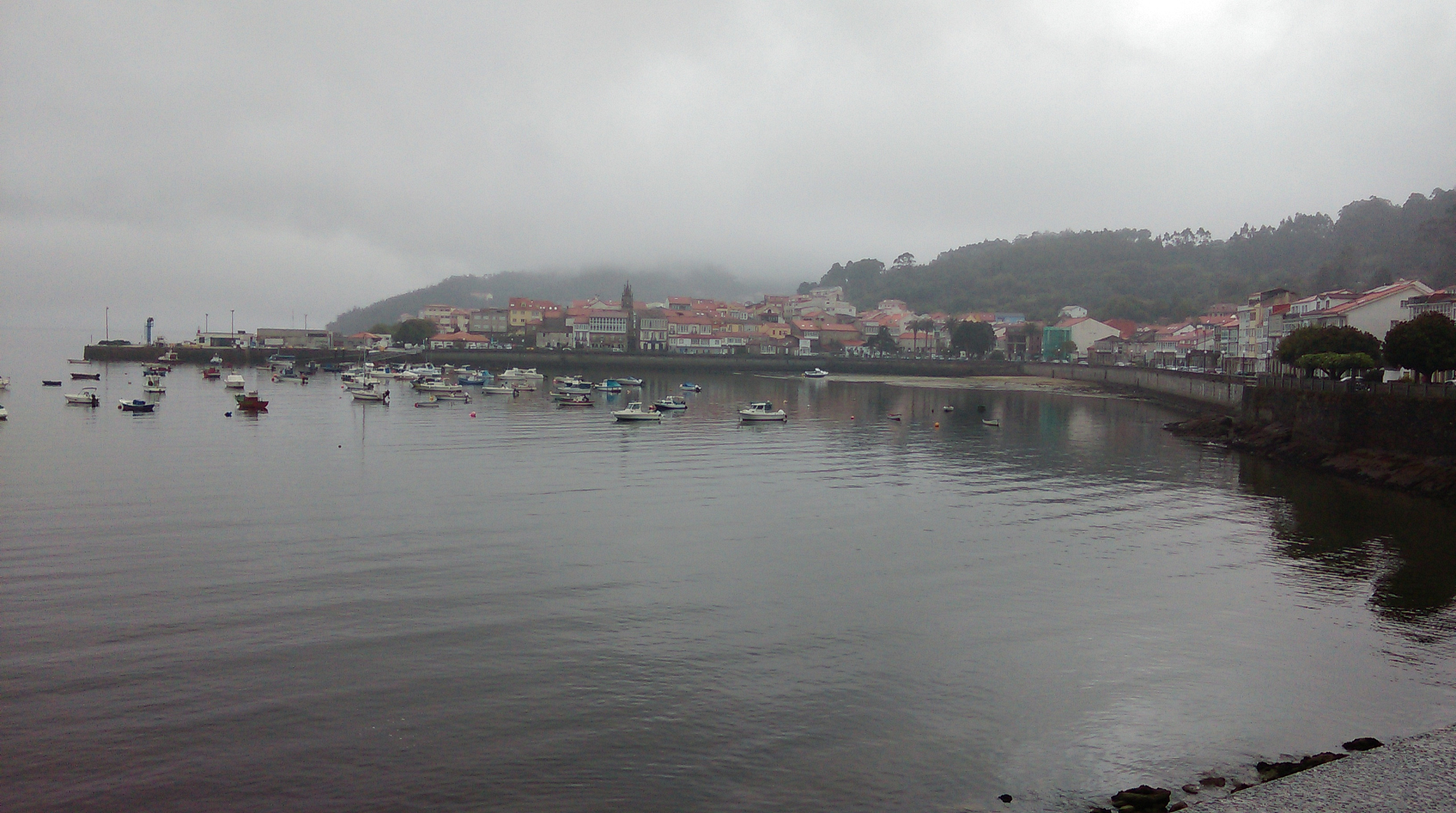 scenic view of sea by city against sky