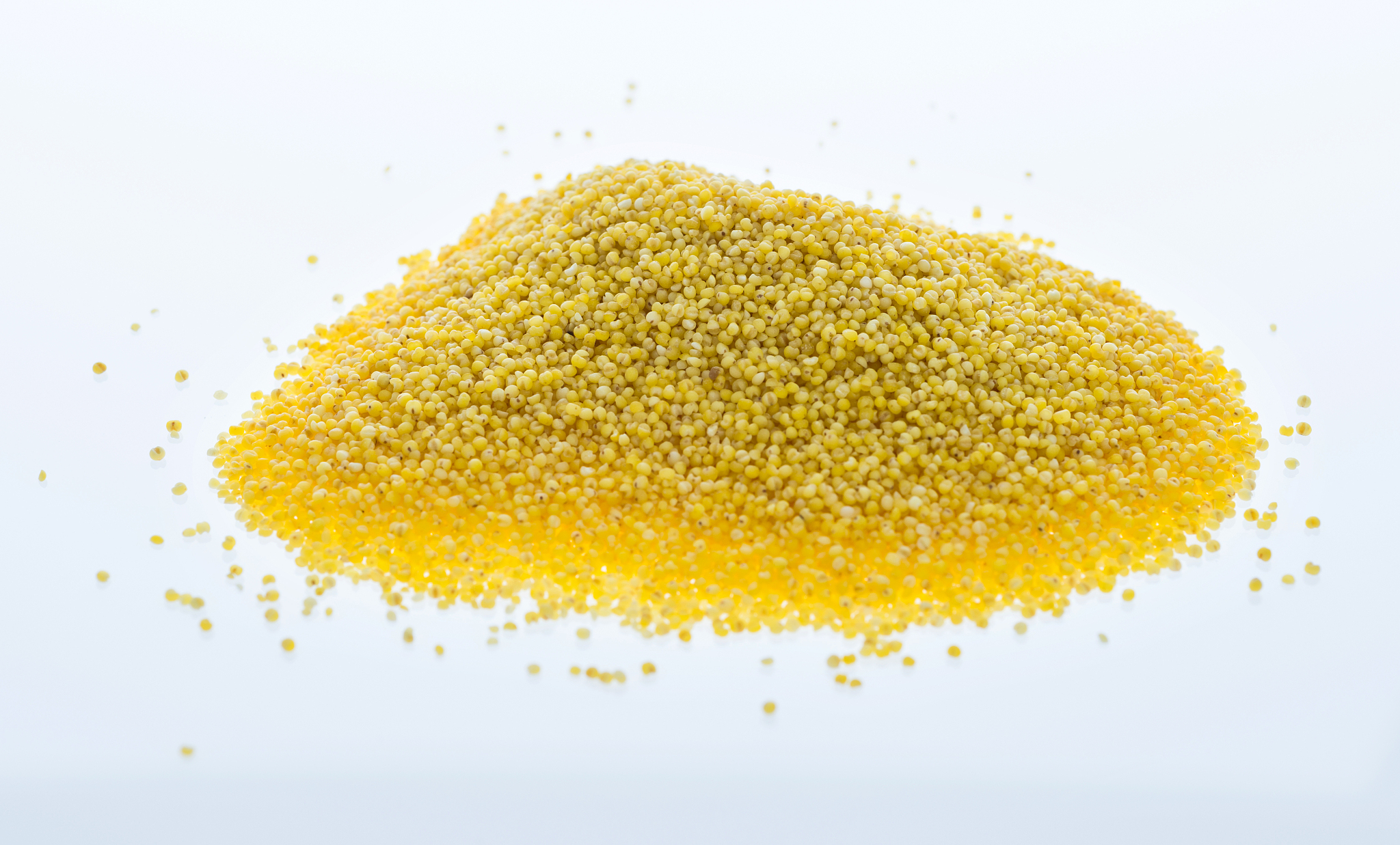 a pile of millet on white background